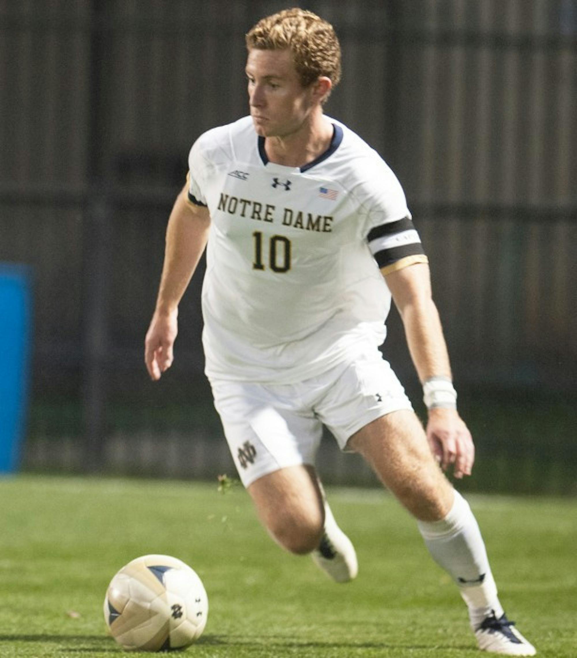 Irish senior Jon Gallagher dribbles the ball during Notre Dame’s 3-1 victory over Michigan on  Tuesday at Alumni Stadium. Gallagher leads Notre Dame in goals and points scored on the season.