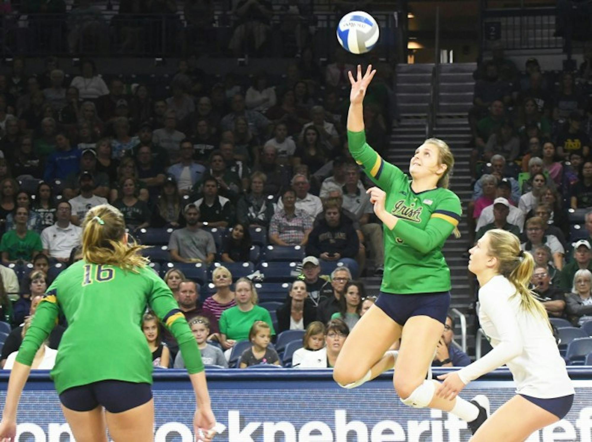 Irish junior outside hitter Rebecca Nunge tips the ball during Notre Dame's 3-0 win over Michigan State at Purcell Pavilion on Sept. 15.