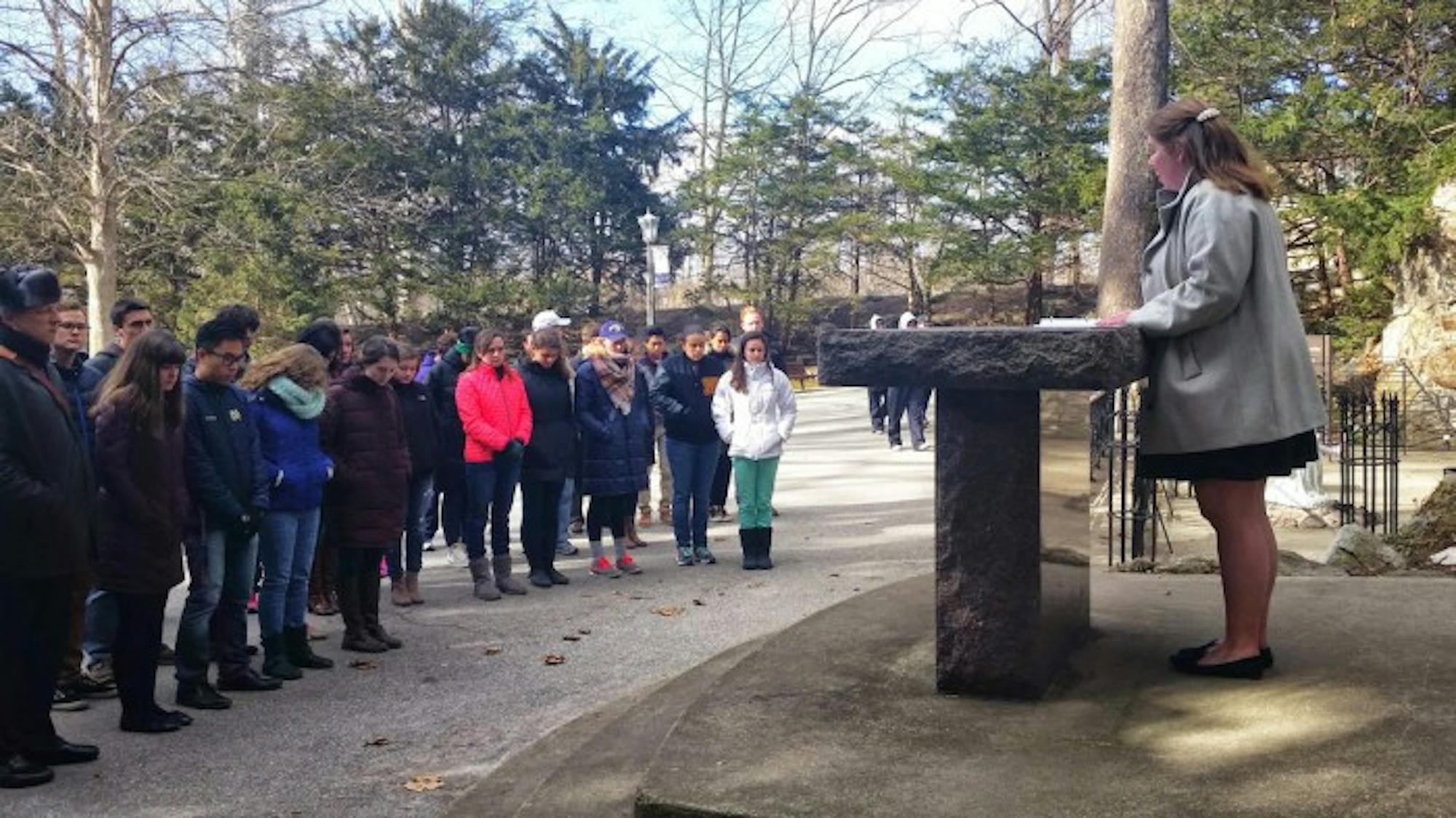 Students gather at the Grotto Friday to pray for victims of sexual violence and for an end to sexual assault on campus.
