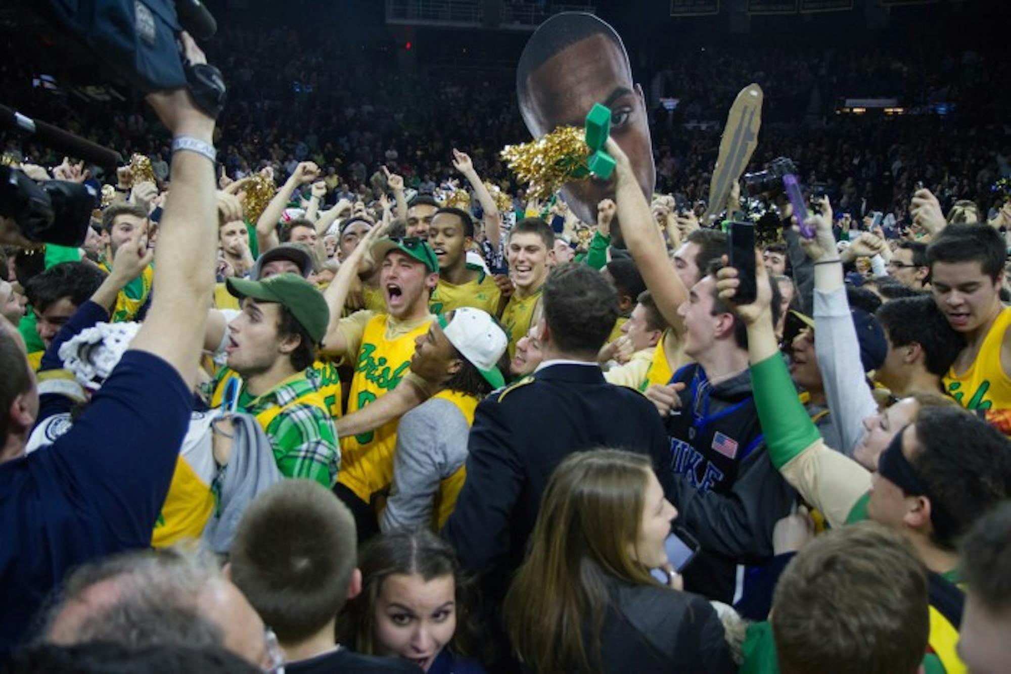 Students celebrate following Notre Dame’s 80-76 win over No. 2 North Carolina on Saturday night at Purcell Pavilion.