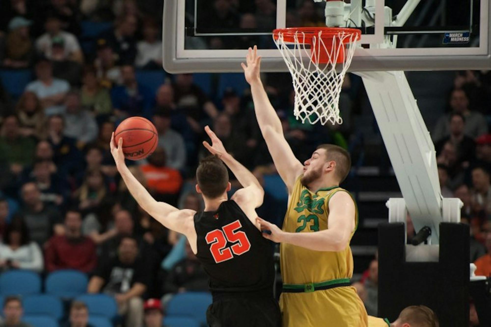 Irish junior forward Martinas Geben contests a shot during Notre Dame's 60-58 victory over Princeton on Thursday at KeyBank Arena. With the win, the Irish advance to the Round of 32 for the third straight year.