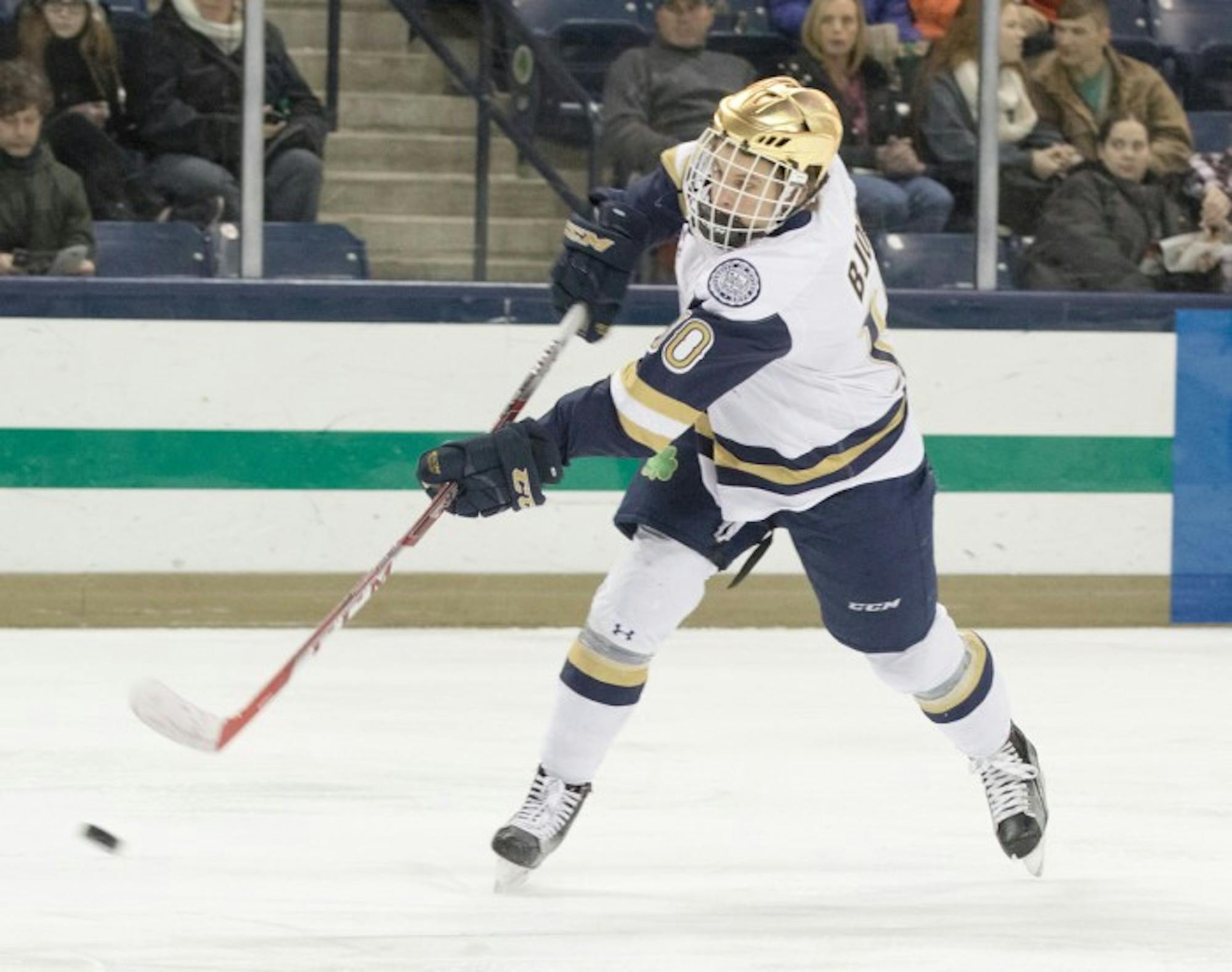 Irish sophomore left wing Anders Bjork snaps a shot on goal during Notre Dame’s 5-1 win over Massachusetts on Dec. 5.