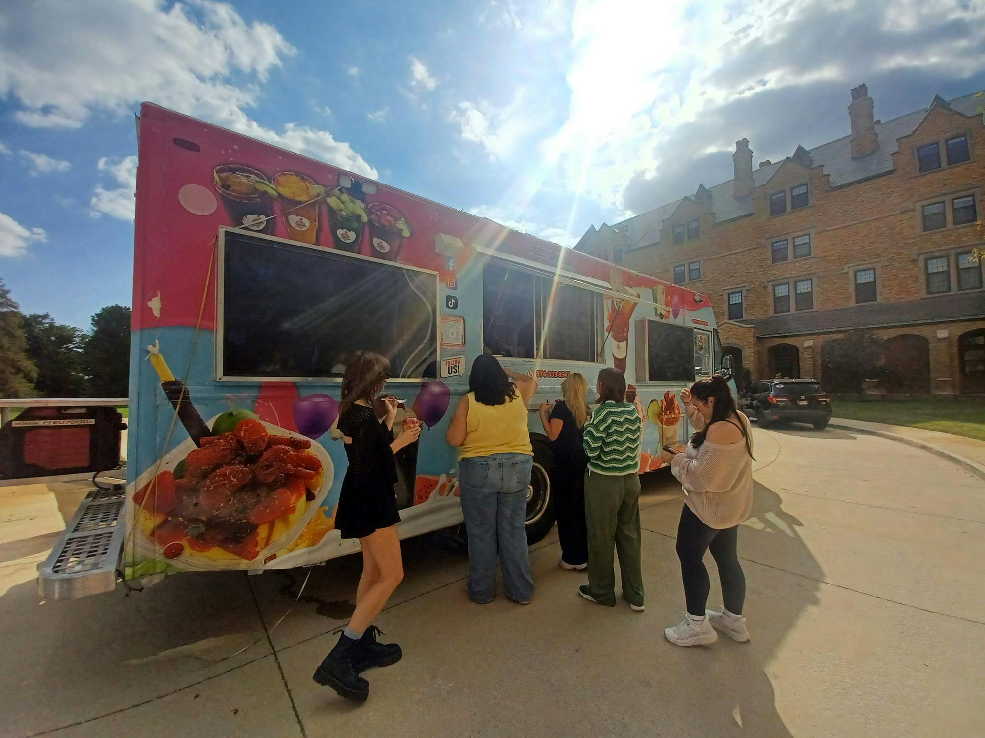 Students line up for food, including the Tropicana Ice Cream Shop
