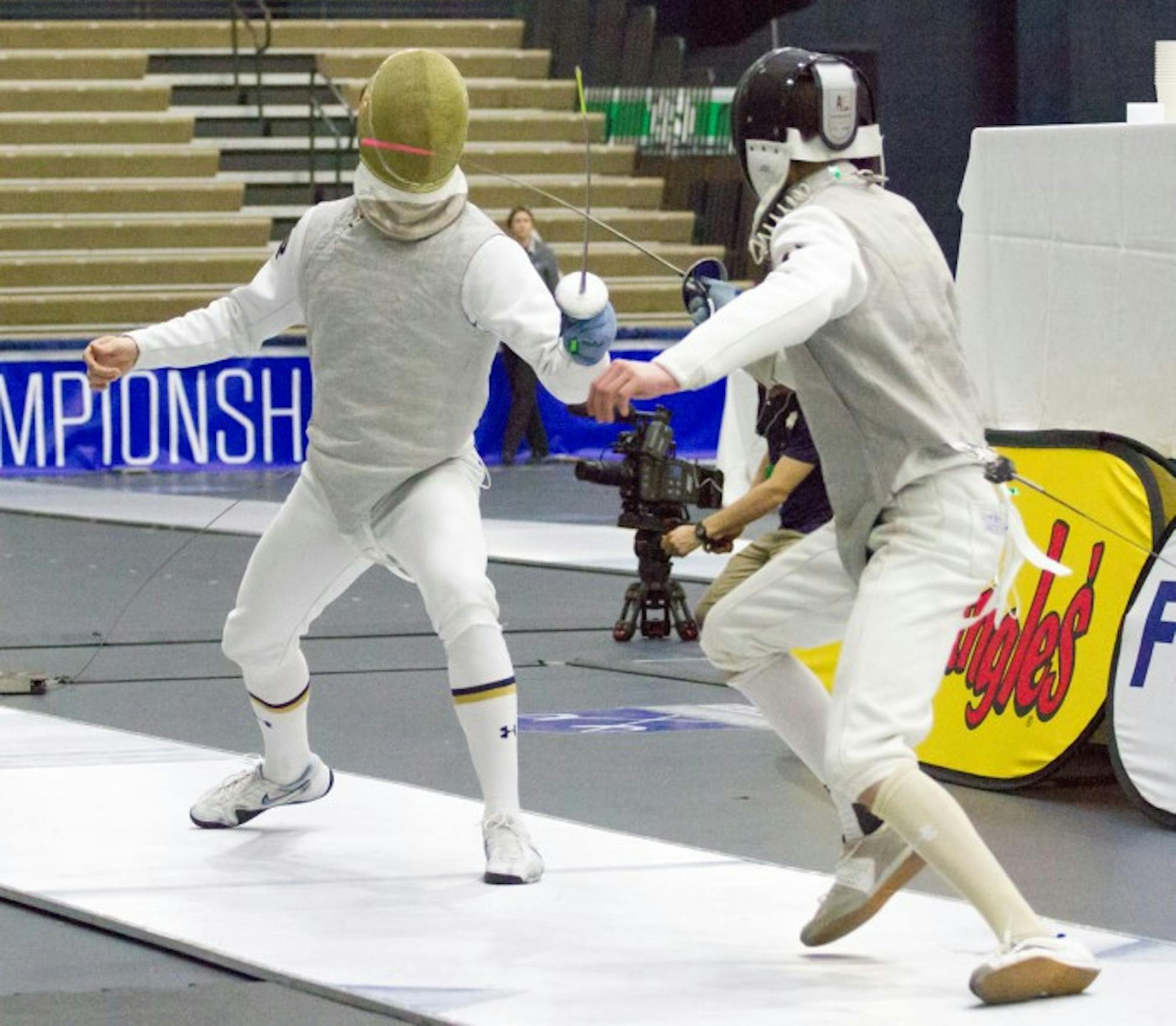 Sophomore foil Virgile Collineau lunges toward his opponent the ACC championships at Castellan Family Fencing Center on Sunday.