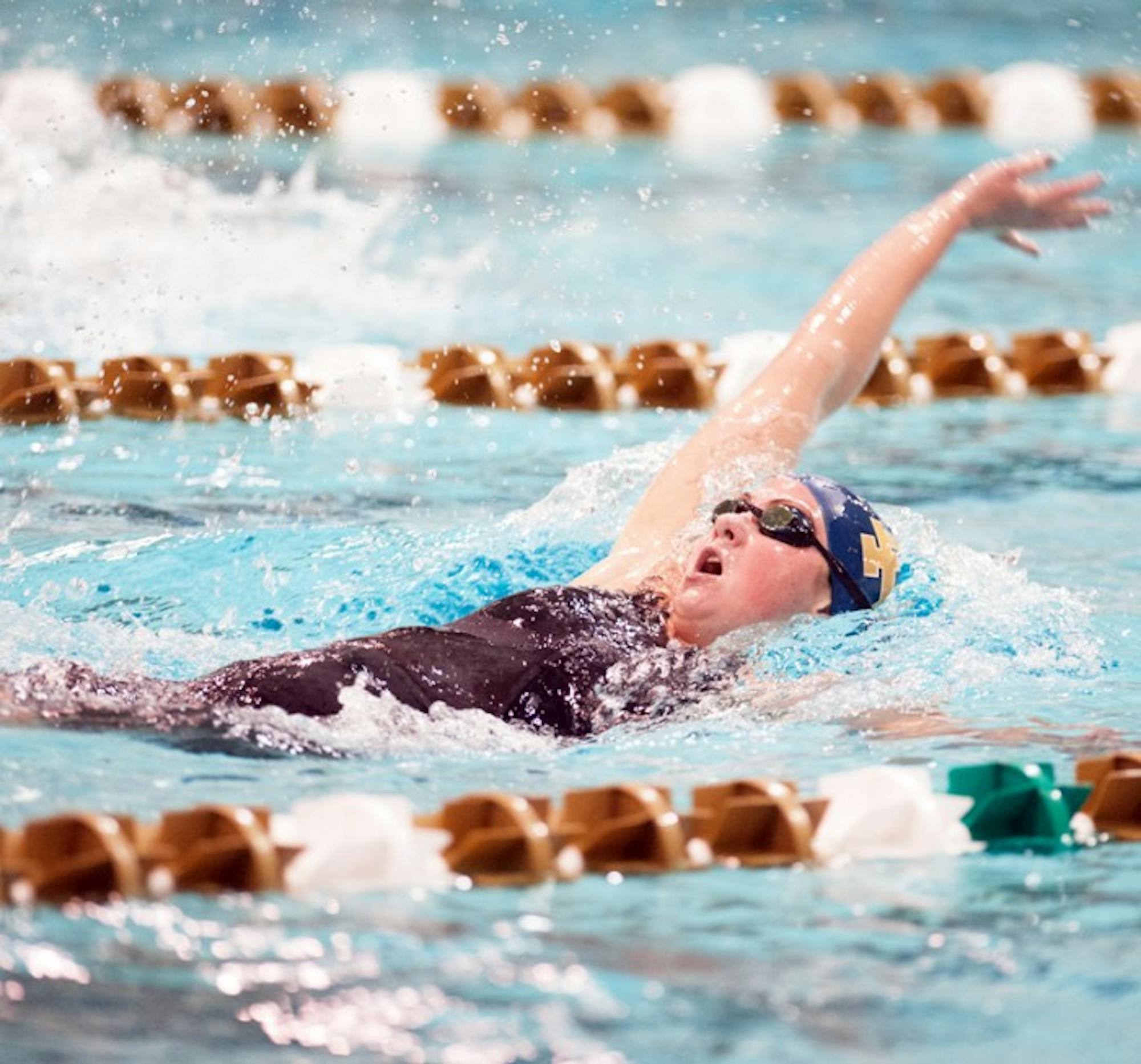 Irish freshman Katie Miller competes in the backstroke at the Shamrock Invitational on Jan. 31.