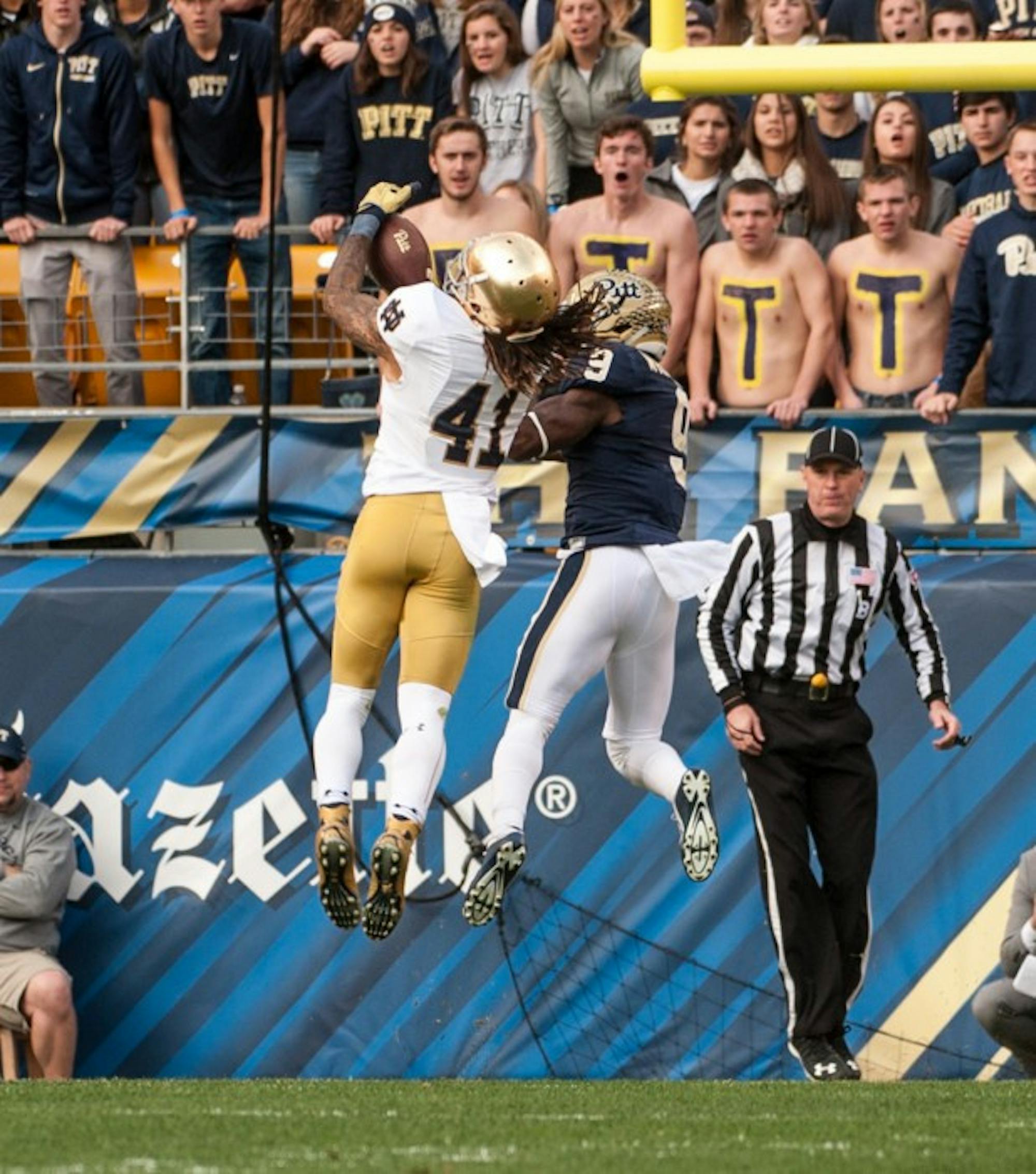 Irish graduate student cornerback Matthias Farley comes down with a second-quarter interception during Saturday’s 42-30 win over Pitt at Heinz Field. Down 14-3, the Panthers were driving to cut into Notre Dame’s lead, but Farley’s interception of Panthers redshirt junior quarterback Nate Peterman at the 1-yard line kept the Irish two scores ahead.