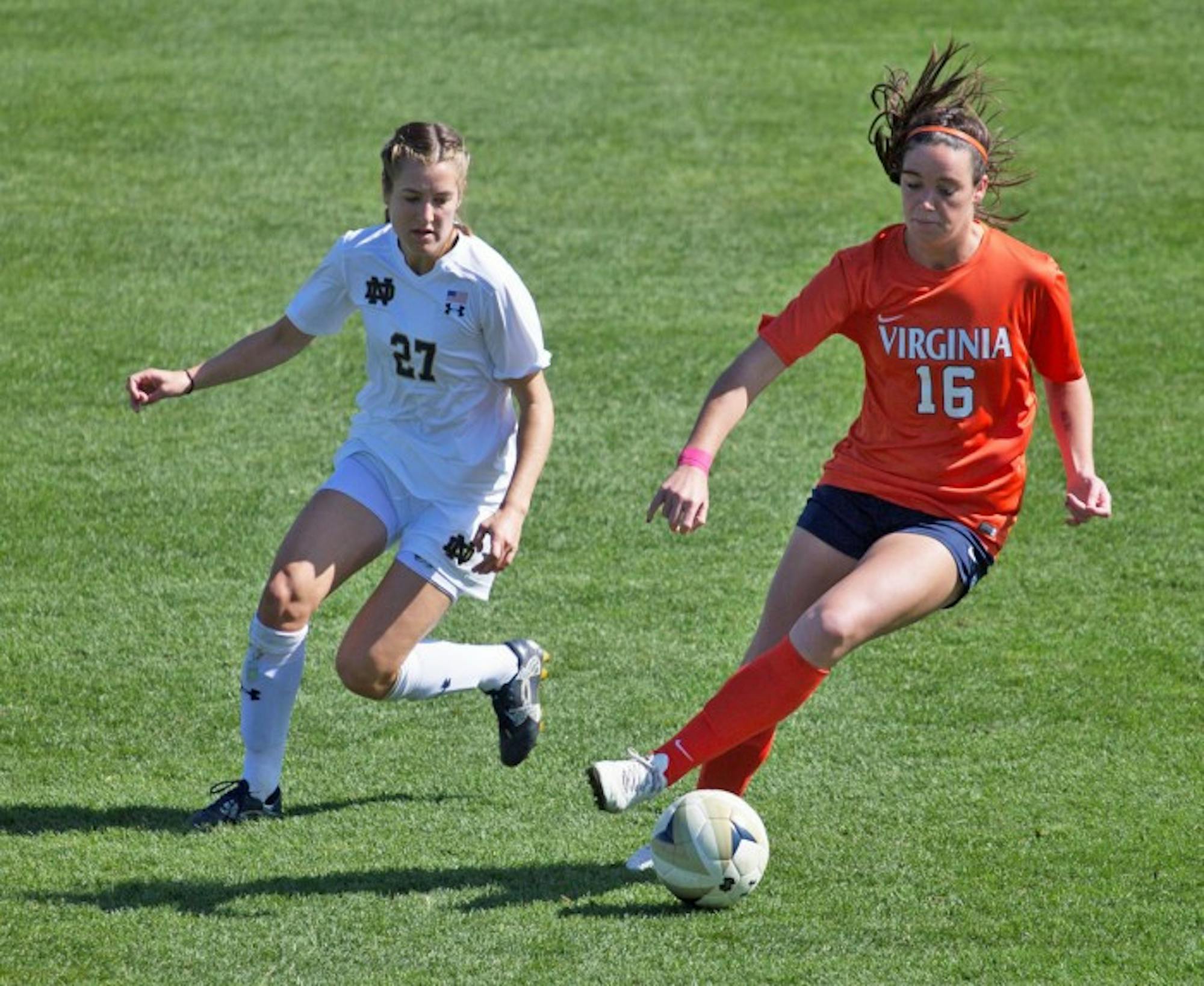 Irish senior forward Kaleigh Olmsted chases down Cavaliers freshman defender Phoebe McClernon during Notre Dame’s 1-0 loss against Virginia on Oct. 9 at Alumni Stadium.