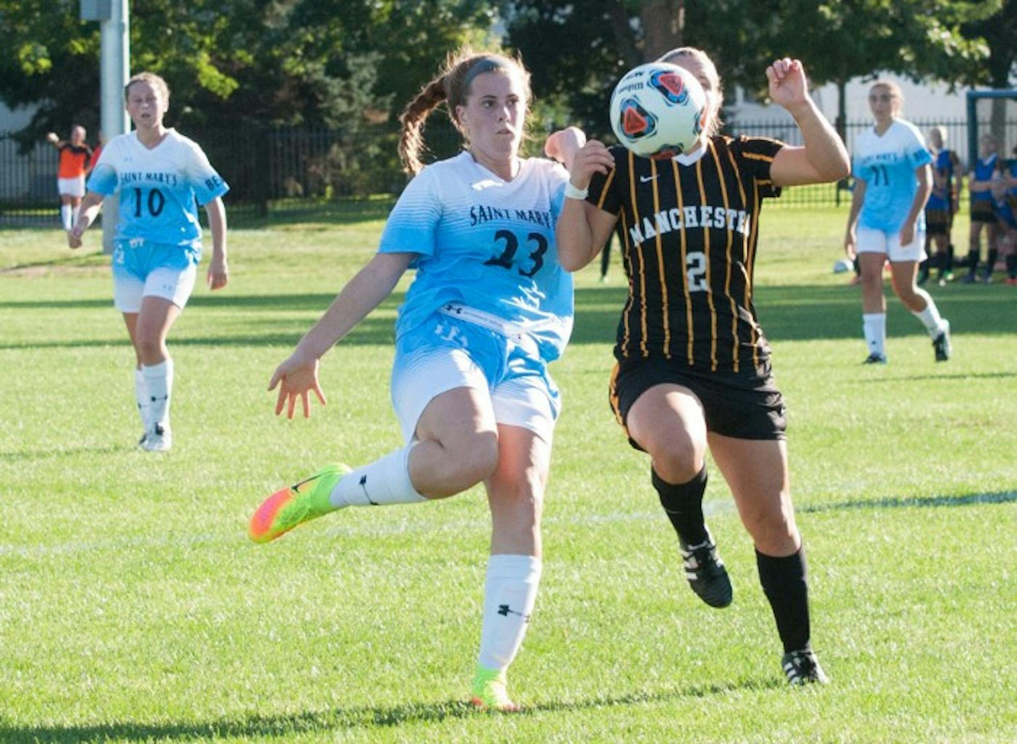 Belles freshman forward Shayleigh O’Donnell fights a defender for the ball during Saint Mary’s 4-1 win over Manchester at the Purcell Athletic Fields on Sept. 2. Saint Mary’s outshot Manchester 13-7 and held a 7-1 advantage in corner kicks.