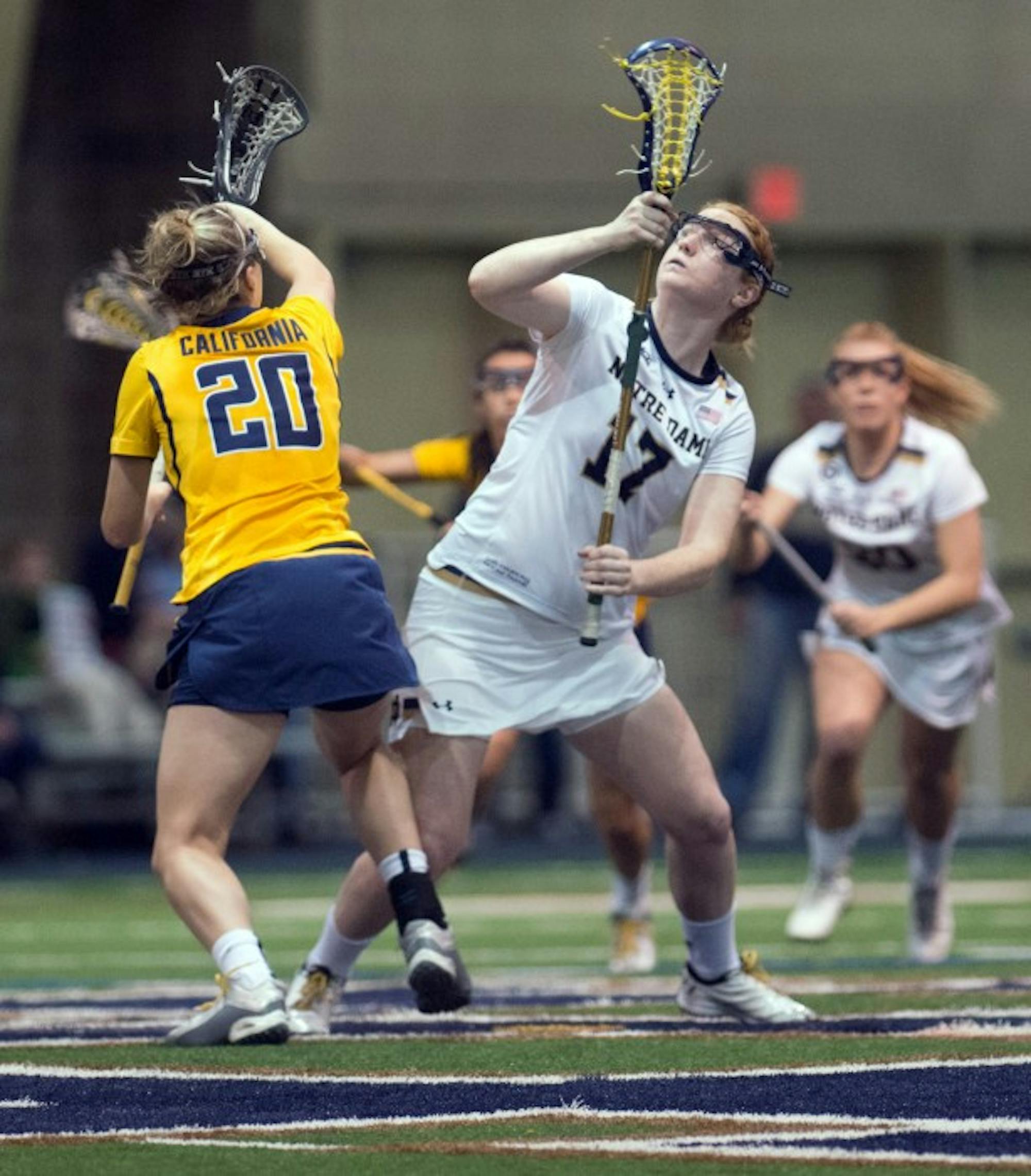 Irish graduate student defender Barbara Sullivan tries to win the draw during Notre Dame’s 21-2 victory over California on Feb. 28.