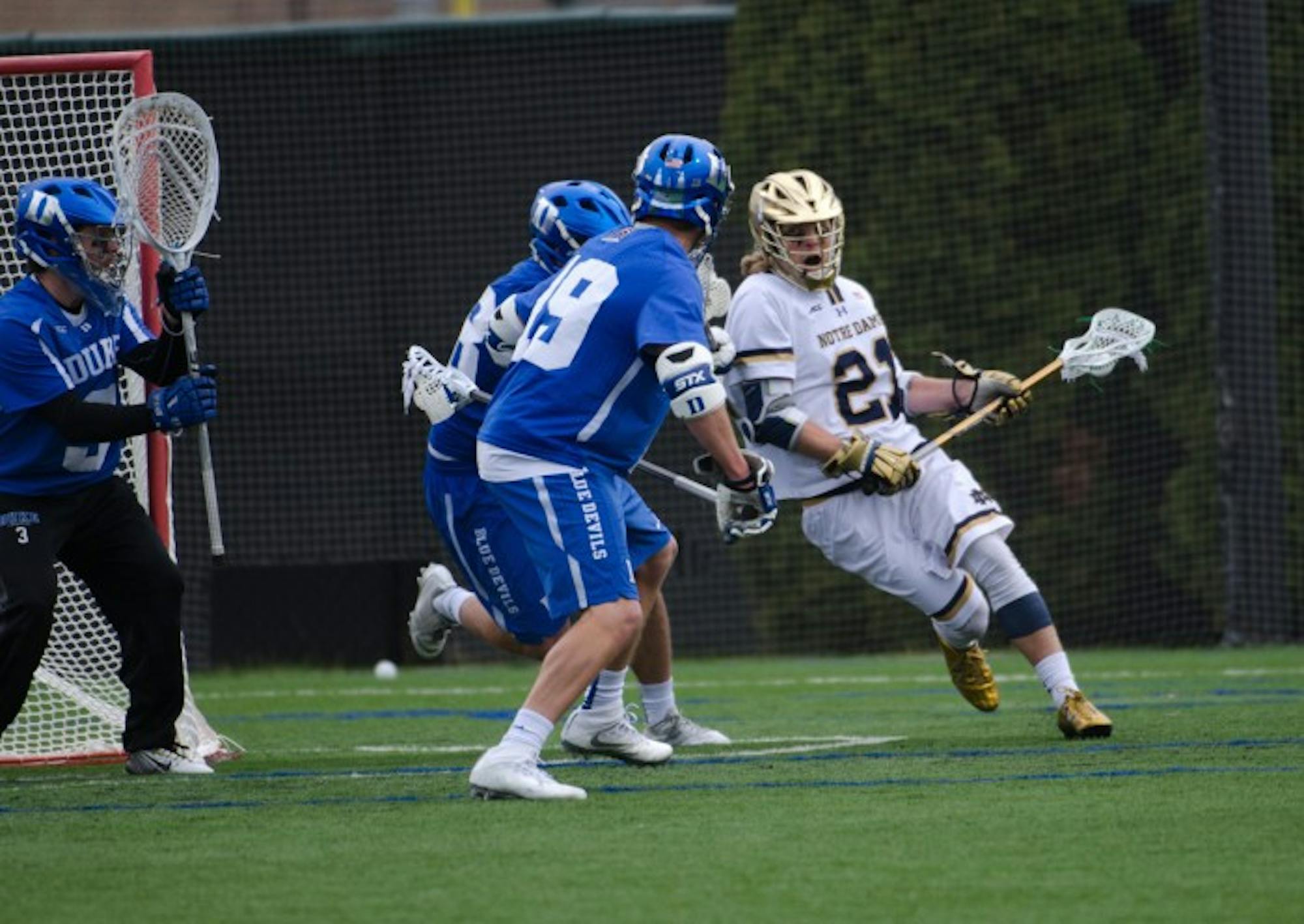 Irish freshman attack Ryder Garnsey fights for a shooting angle during Notre Dame’s 8-6 win over Duke on April 10 at Arlotta Stadium.