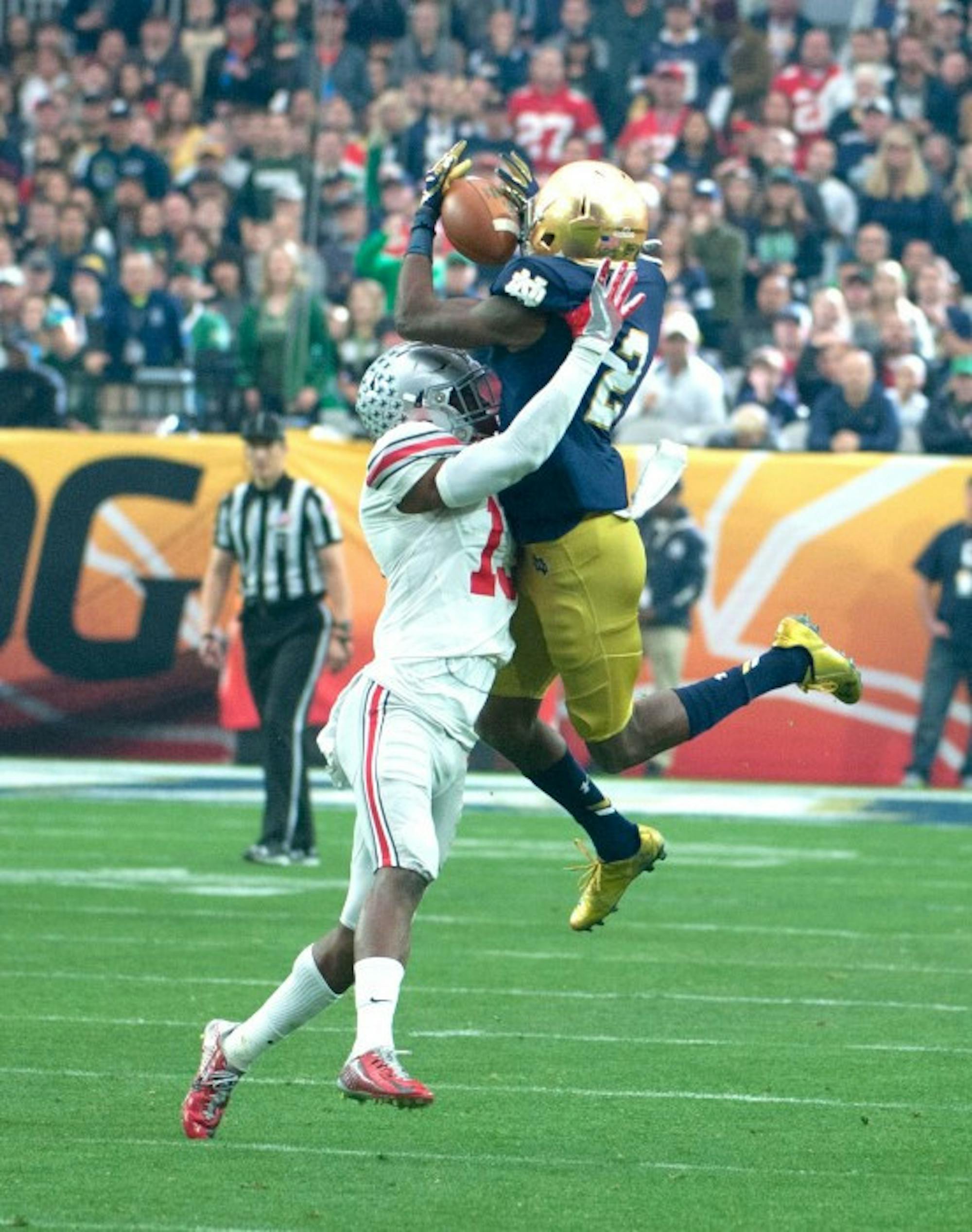 Senior receiver Chris Brown battles for the ball in the air with Ohio State sophomore Eli Apple during Notre Dame's 44-28 loss to the Buckeyes on Friday in Glendale, Arizona. Brown had four catches, including a touchdown, for 35 yards in the game.