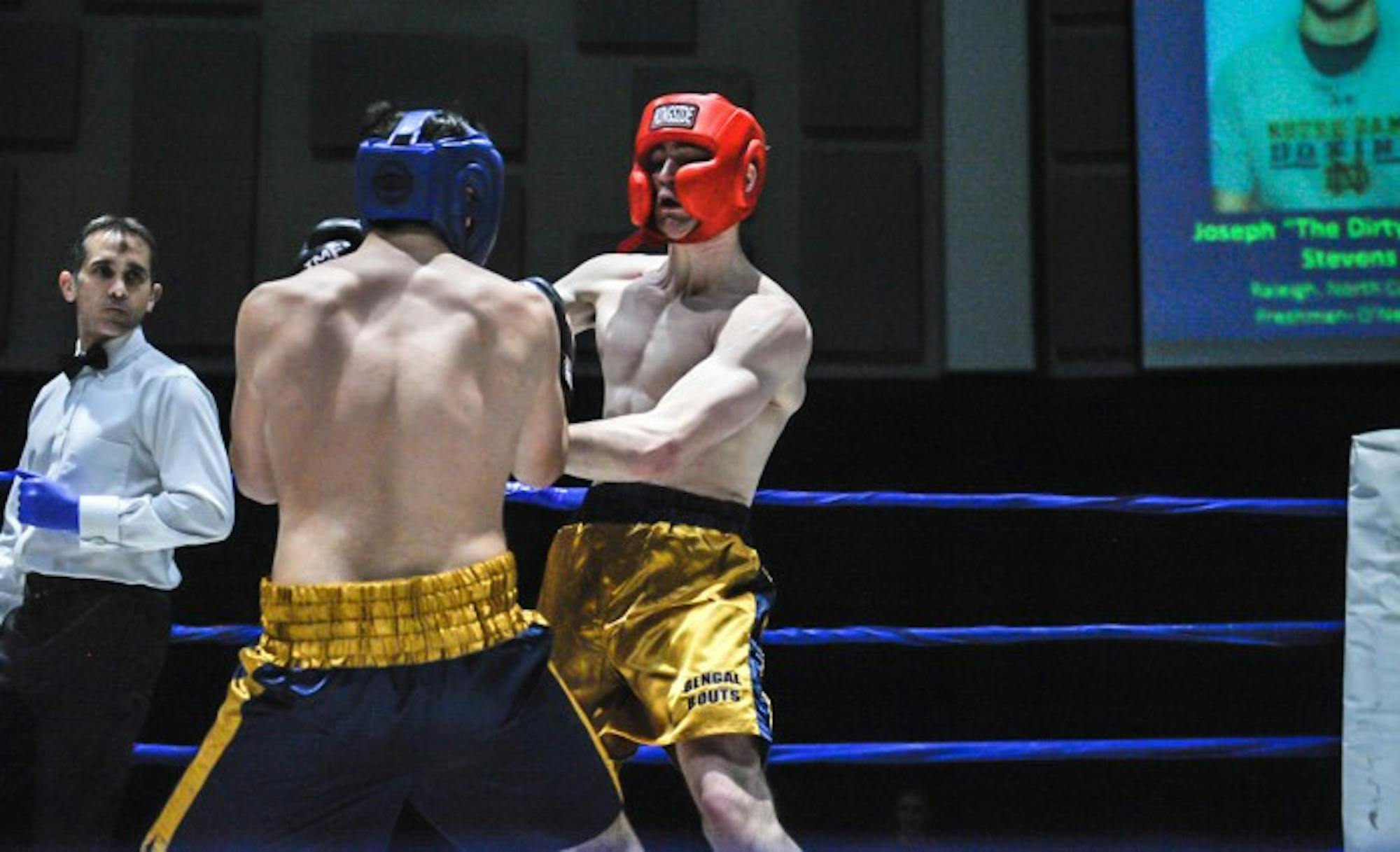Senior captain and men's boxing president Jack Considine tangles with his opponent, Joseph Stevens, during the quarterfinal round of the 2015 Bengal Bouts on Feb. 18, 2015.