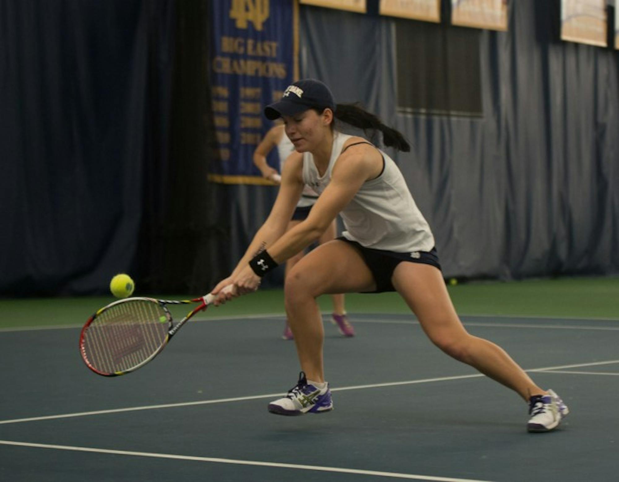 Notre Dame freshman Allison Miller stretches for a backhand  during her and junior Julie Vrabel's Feb. 4 doubles match against Stanford.