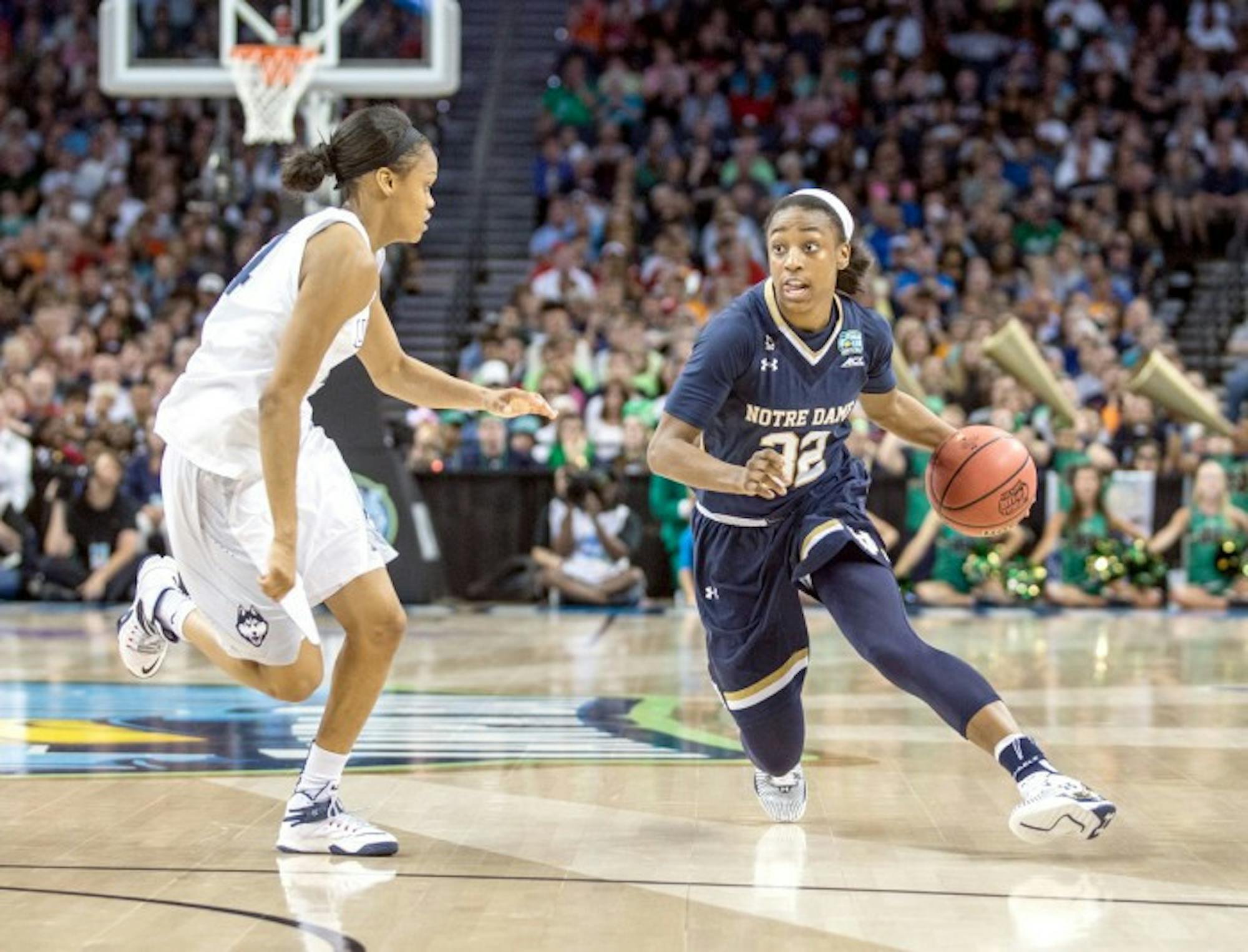Irish junior guard Jewell Loyd drives against Connecticut junior guard Moriah Jefferson during Notre Dame’s 63-53 loss in the national championship. Loyd finished the game with 12 points and five rebounds.