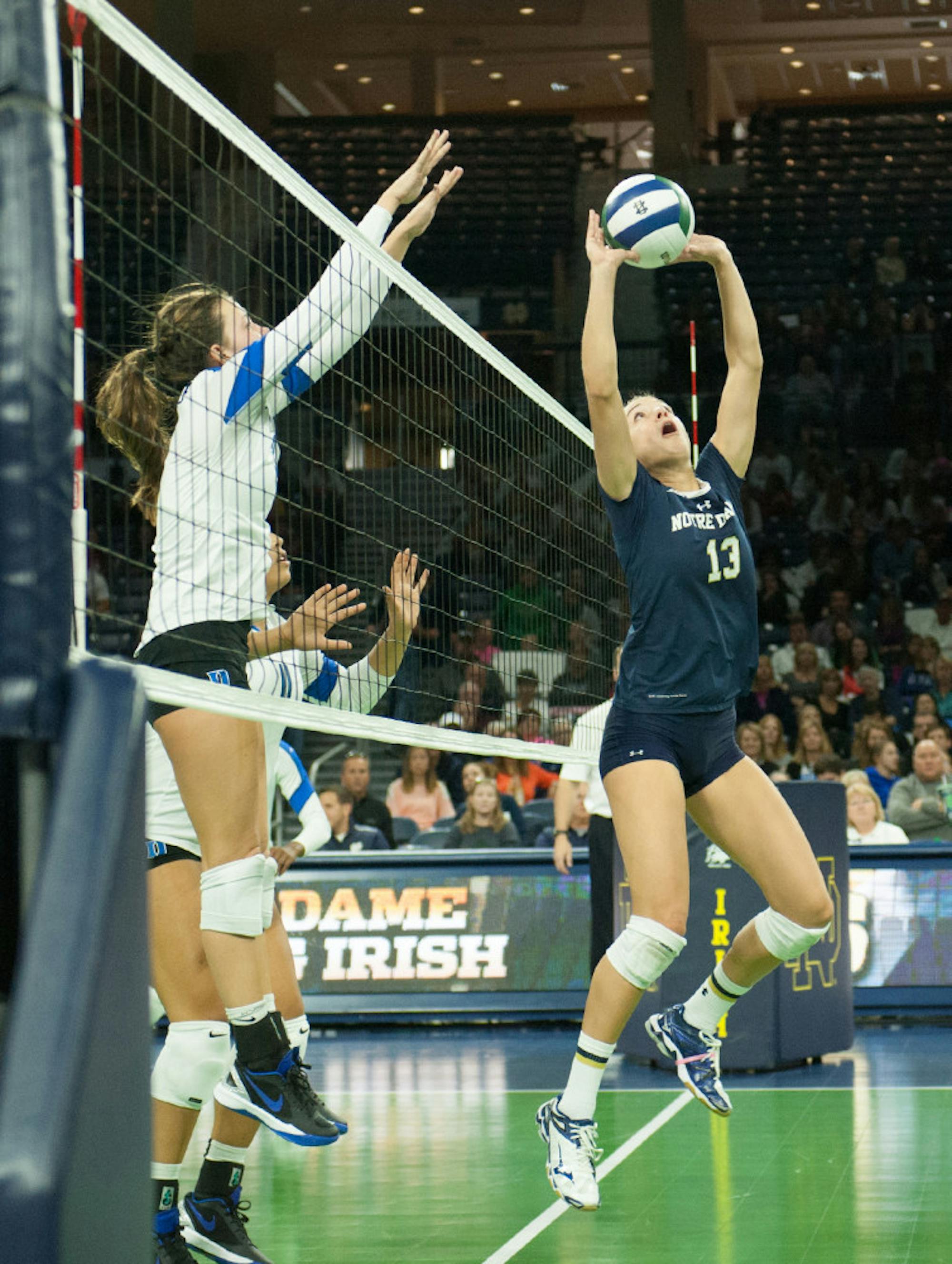 Irish junior setter Hanna Muzzonigro sets the ball to a teammate in Notre Dame’s 3-1 loss to Duke on Oct. 5 at Purcell Pavilion.