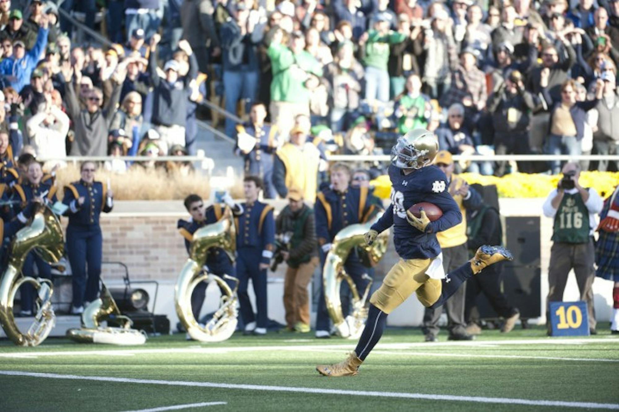 Irish sophomore defensive lineman Andrew Trumbetti runs into the end zone as he returns an interception for a 28-yard touchdown during Notre Dame’s 28-7 win over Wake Forest on Saturday at Notre Dame Stadium. The interception was Trumbetti’s first in just his second career start, and put Notre Dame up 14-0 late in the first quarter.