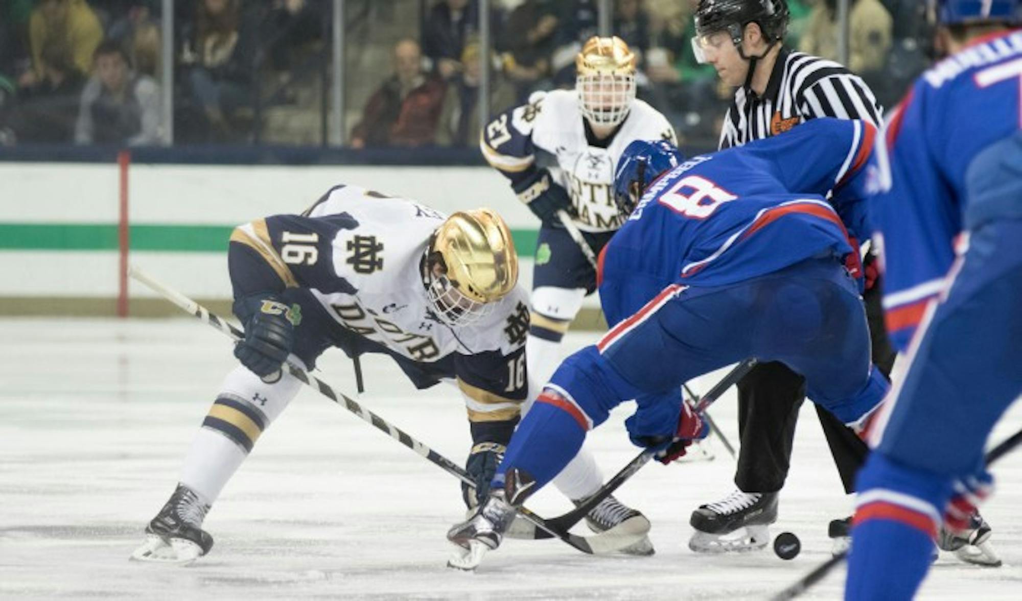 Irish junior forward Connor Hurley takes the face-off during Notre Dame’s 4-1 loss to UMass Lowell on Thursday at Compton Family Ice Arena.