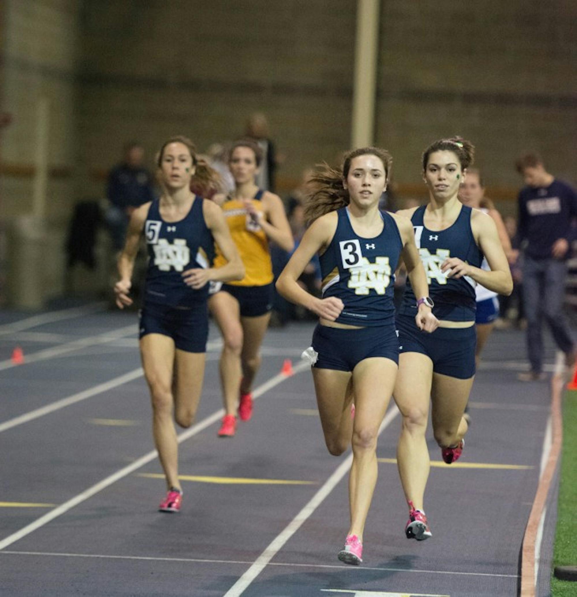 Irish senior Danielle Aragon, center, leads a pack of runners during the Blue & Gold Invitational on Dec. 5, 2014, at Loftus Sports Center. Aragon will compete in the distance medley relay Saturday.