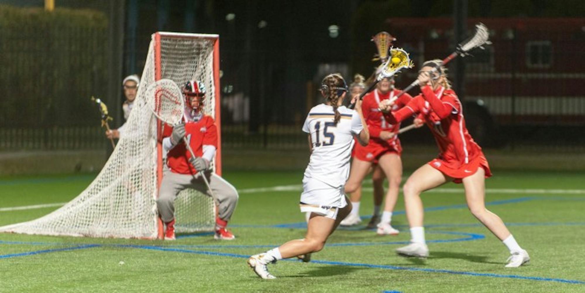 Irish senior attack Cortney Fortunato drives toward the goal during Notre Dame’s 16-13 win over Ohio State on March 7 at Arlotta Stadium. Fortunato scored three goals and had one assist during Notre Dame’s 13-9 Senior Day win over Virginia Tech on Saturday.