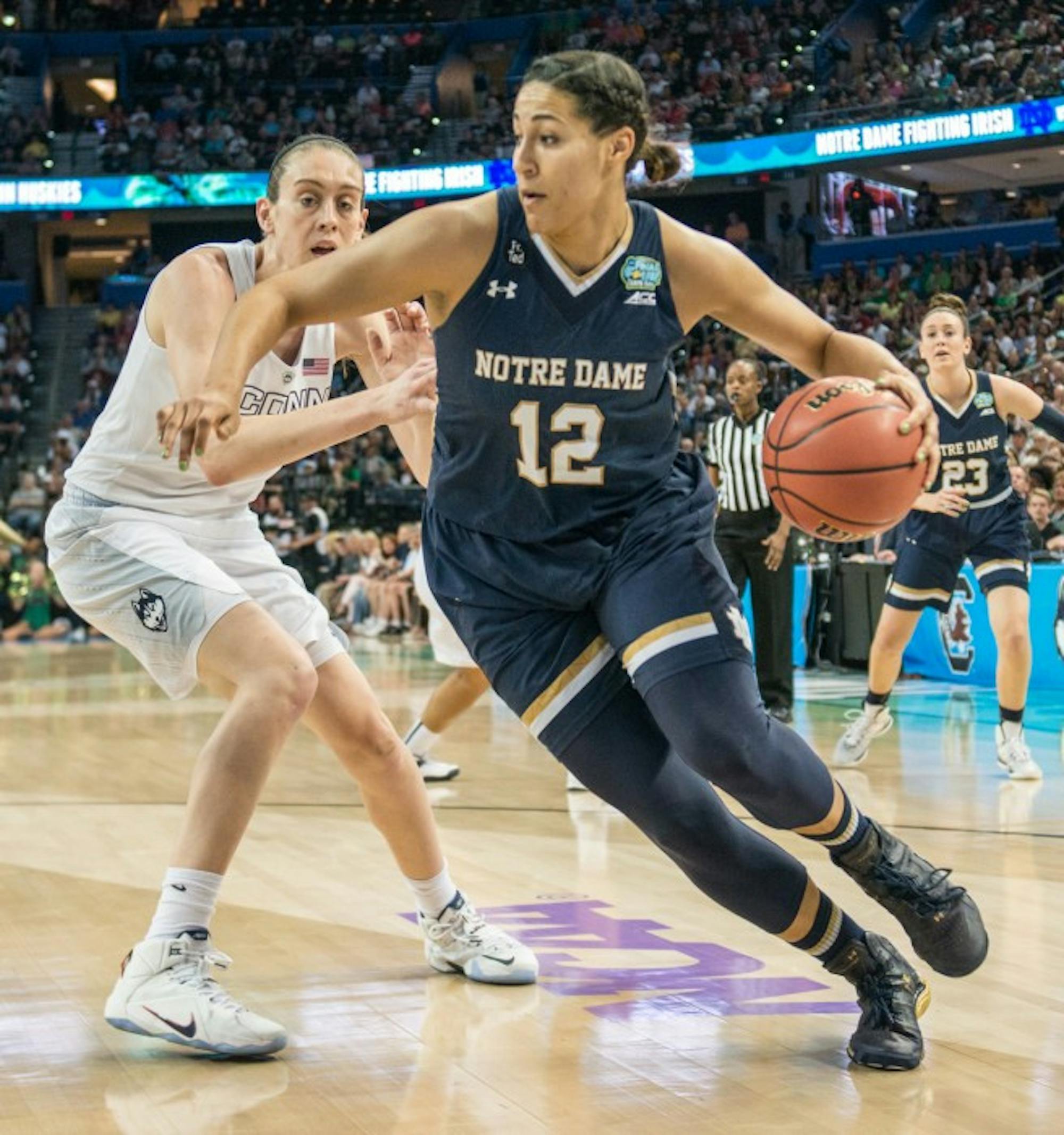 unior forward Taya Reimer dribbles around Breanna Stewart in Notre Dame’s 63-53 loss to  Connecticut on April 7 in the national championship game at Amalie Arena in Tampa, Florida