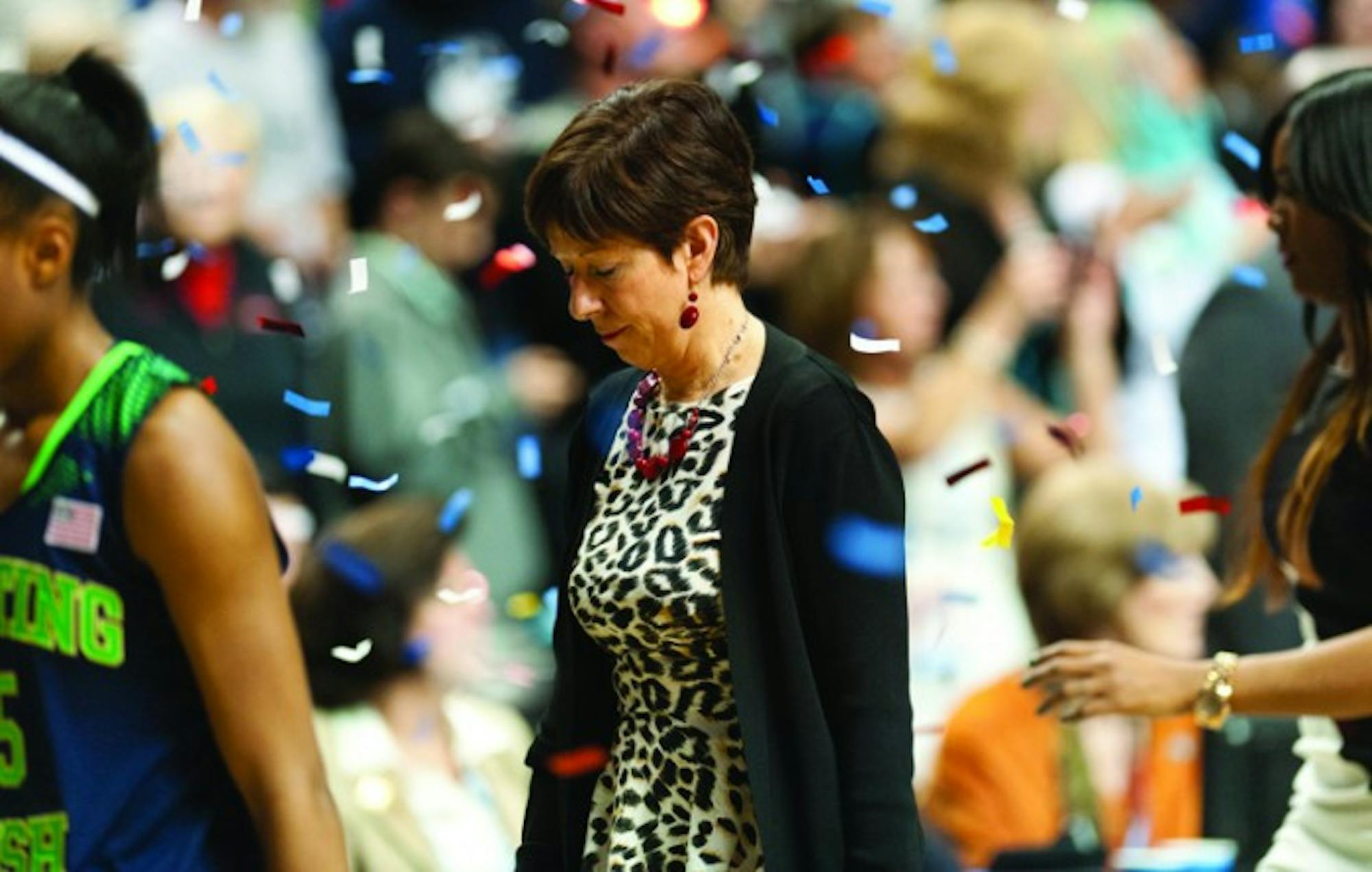 Irish coach Muffet McGraw exits the court under a shower of confetti after Notre Dame’s 79-58 loss to Connecticut in the national championship game Tuesday at Bridgestone Arena in Nashville, Tenn. The defeat was Notre Dame’s first of the season after entering the contest with a perfect 37-0 mark and brings the team’s record in the Final Four to 5-5.