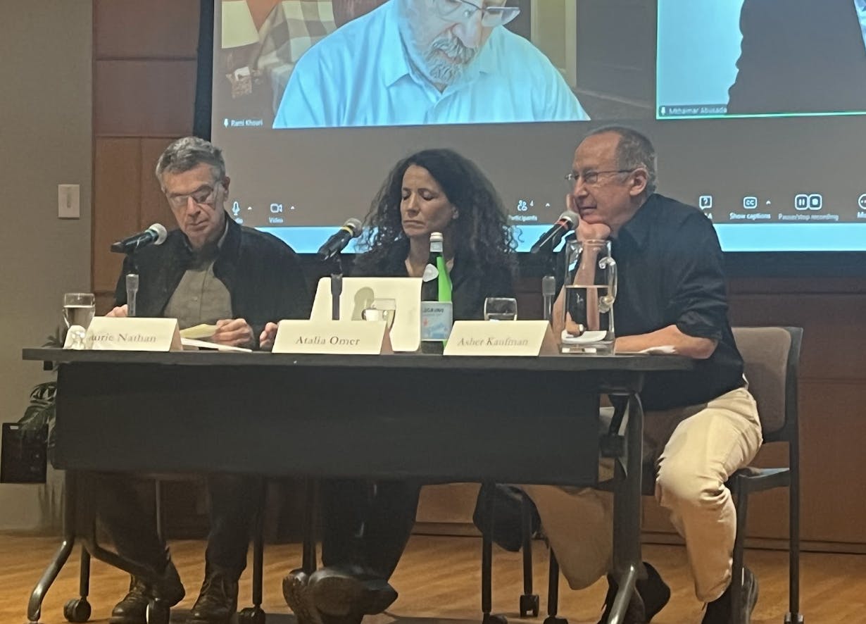 Professors Laurie Nathan, Atalia Omer and Asher Kaufman discussed the Israel Hamas ceasefire in a lecture for the Kroc Institute. Projected on the screen behind them were Mkhaimar Abusada, a professor at Al-Azhar University in Gaza, and Rami Khouri, a public policy fellow at the American University of Beirut, who joined the conversation virtually via Zoom. 