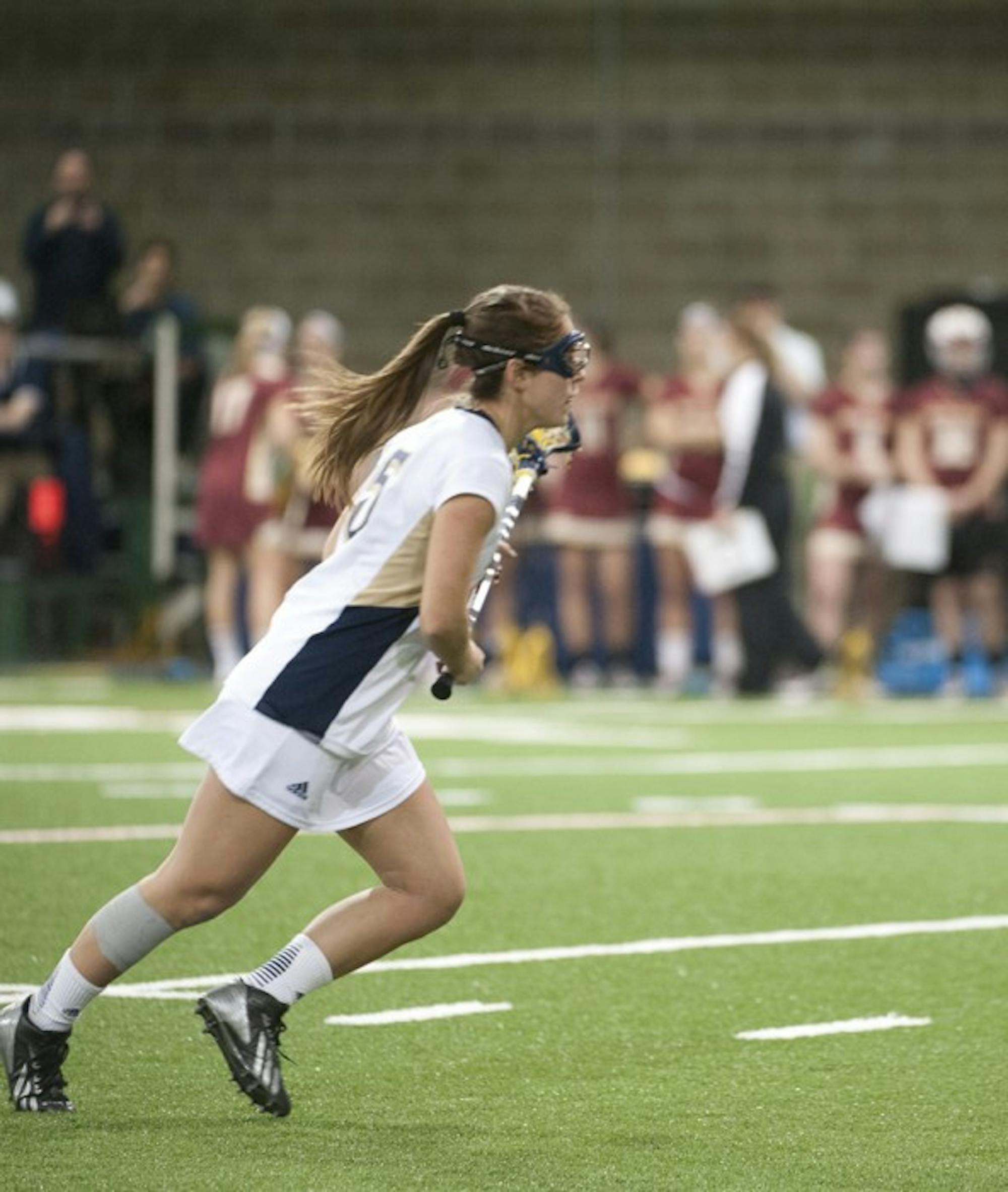 Irish sophomore attack Rachel Sexton races upfield during Notre Dame’s 15-10 loss to Boston College on Saturday.
