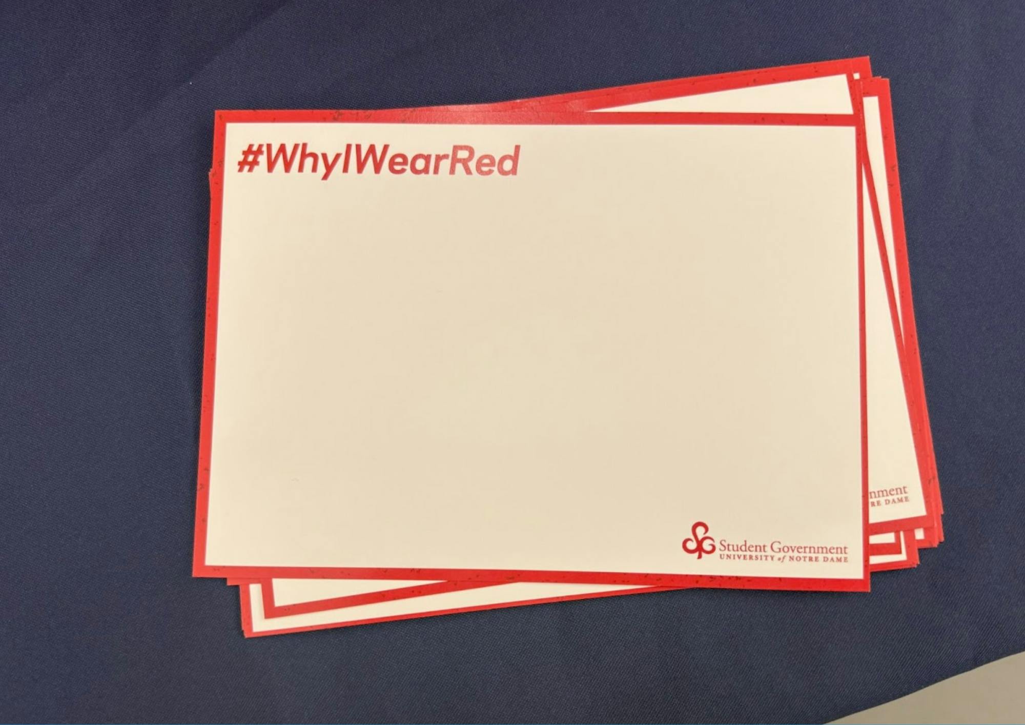 #WhyIWearRed cards were displayed on student government table
