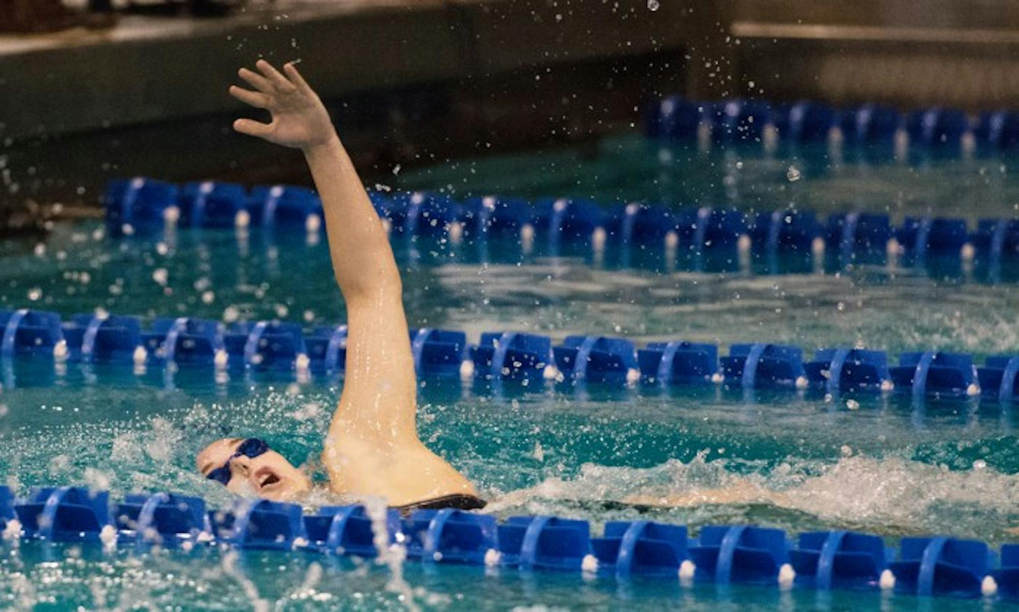 Senior Courtney Whyte comes up for air during a meet against Purdue on Nov. 1 at Rolf’s Aquatic Center. Whyte finished second in the 200-yard backstroke during the meet.