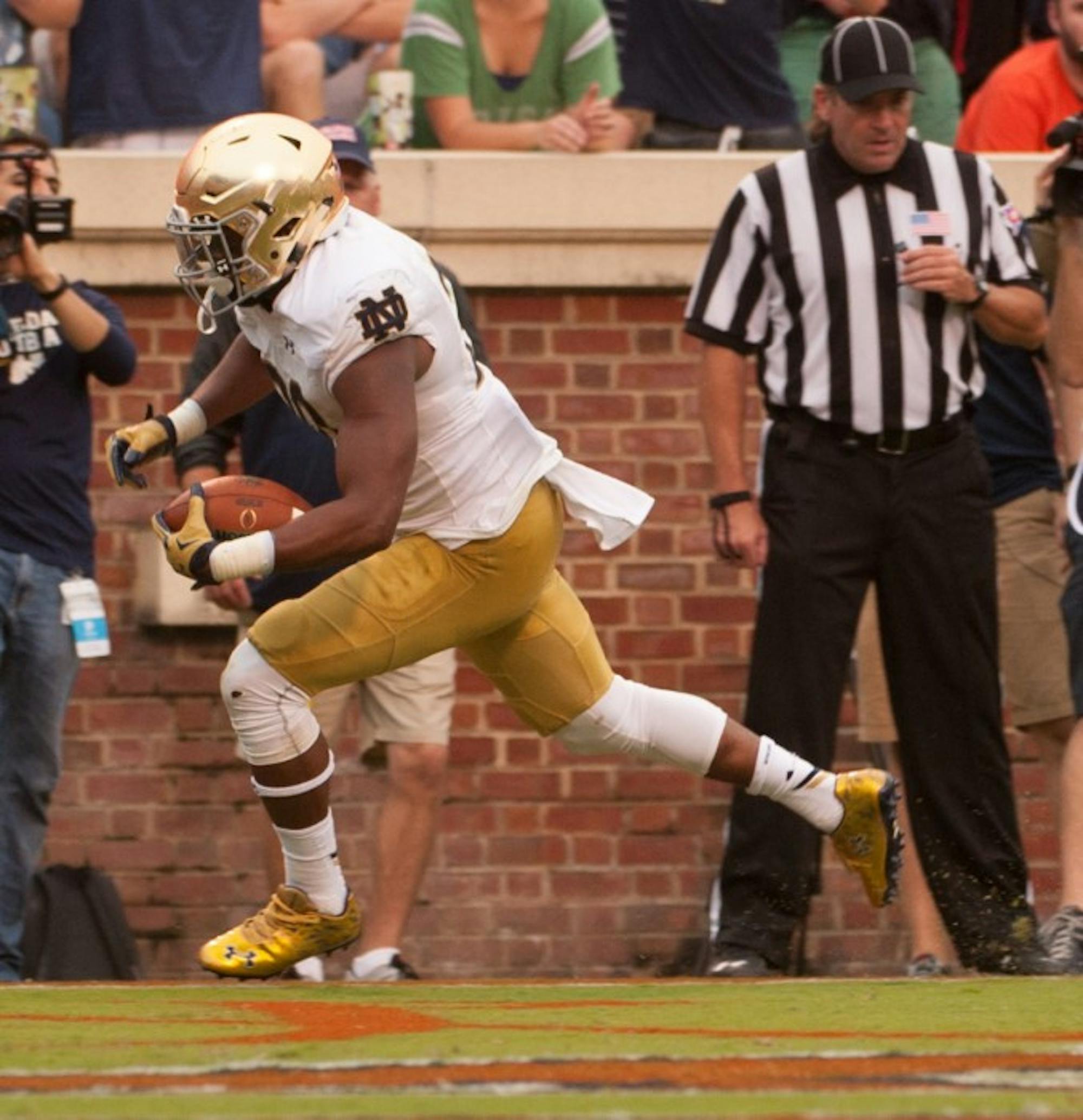 On DeShone Kizer’s first snap against Virginia, senior running back C.J. Prosise scores from 24 yards out in the third quarter.