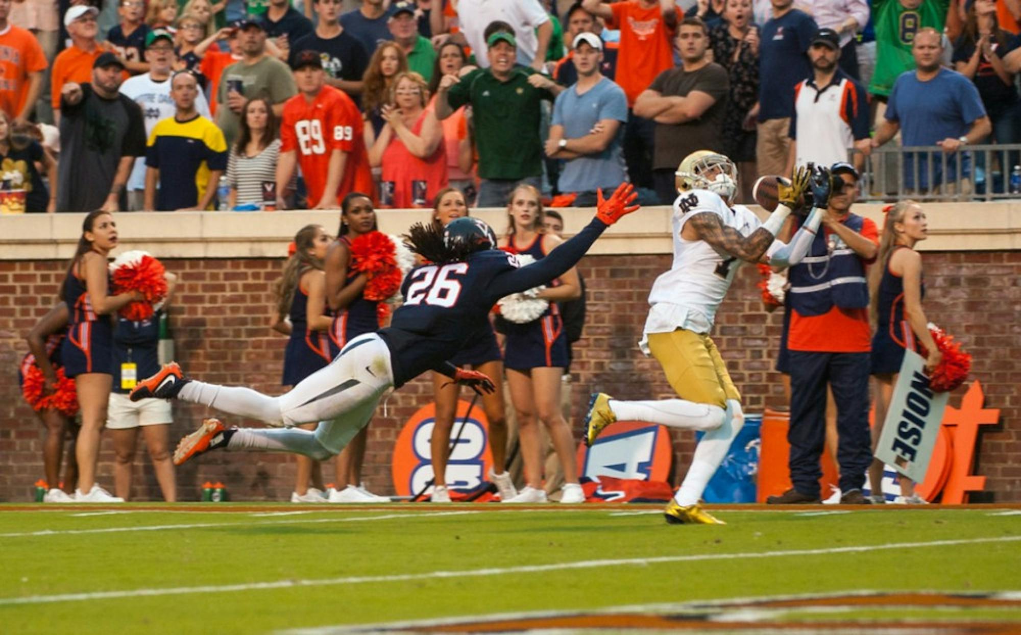 Former Irish receiver Will Fuller hauls in the game-winning touchdown reception over a defender during Notre Dame’s 34-27 win over Virginia on Sept. 12. Fuller was selected 21st overall in the NFL Draft.