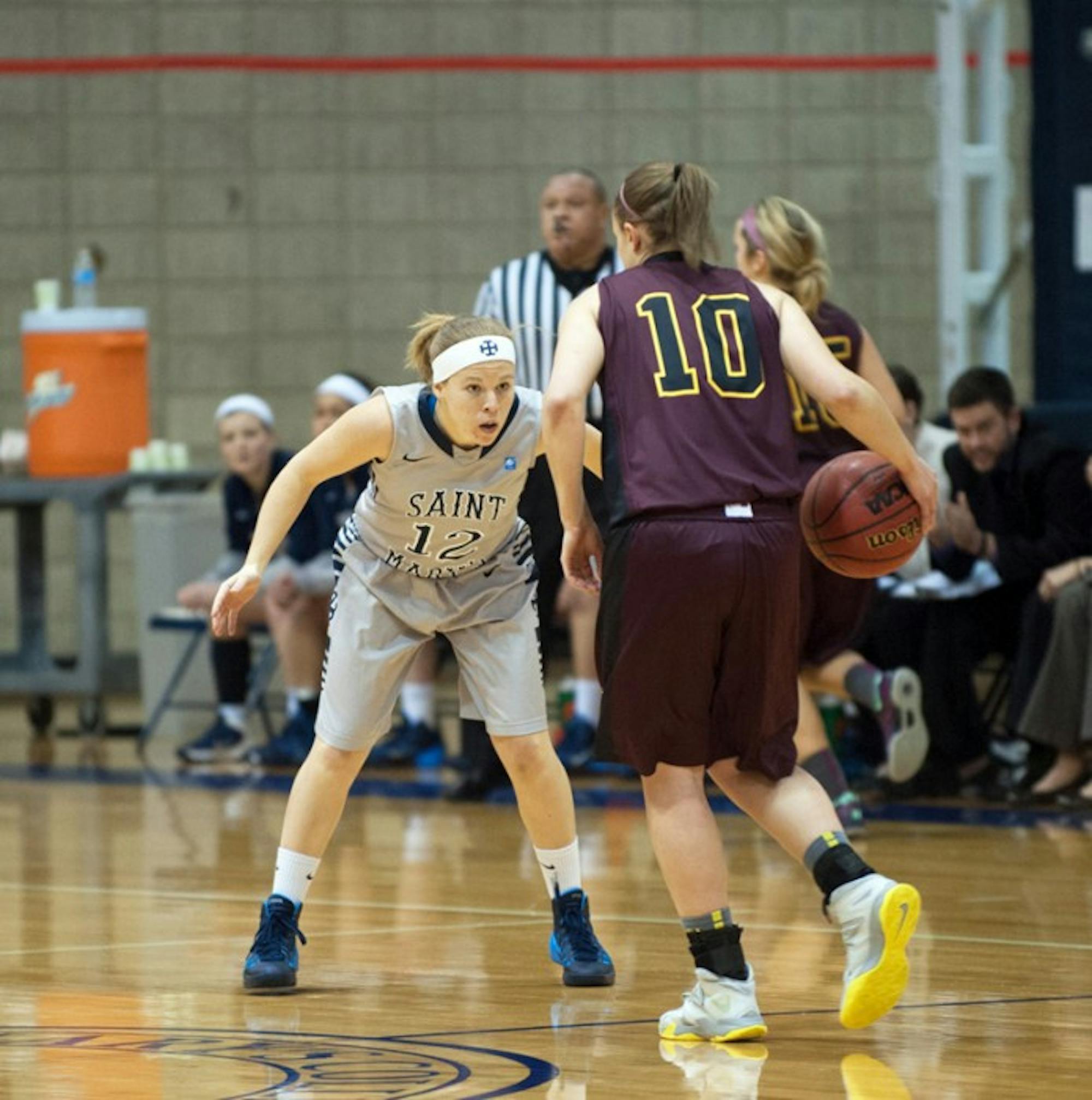 Saint Mary’s sophomore guard Maddie Kohler pressures the ball  during the Belles’ 95-68 loss to Calvin on Jan. 15.