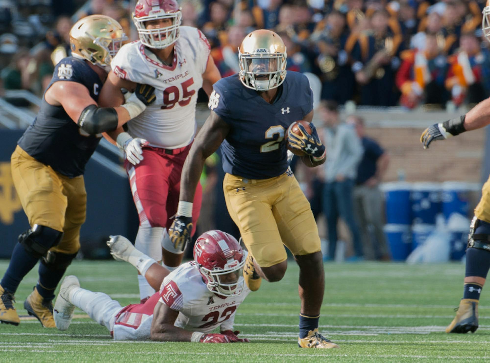 Irish junior running back Dexter Williams eludes a defender and looks upfield during Notre Dame’s 49-16 win over Temple at Notre Dame Stadium. Williams had 124 yards on just six carries and one touchdown.
