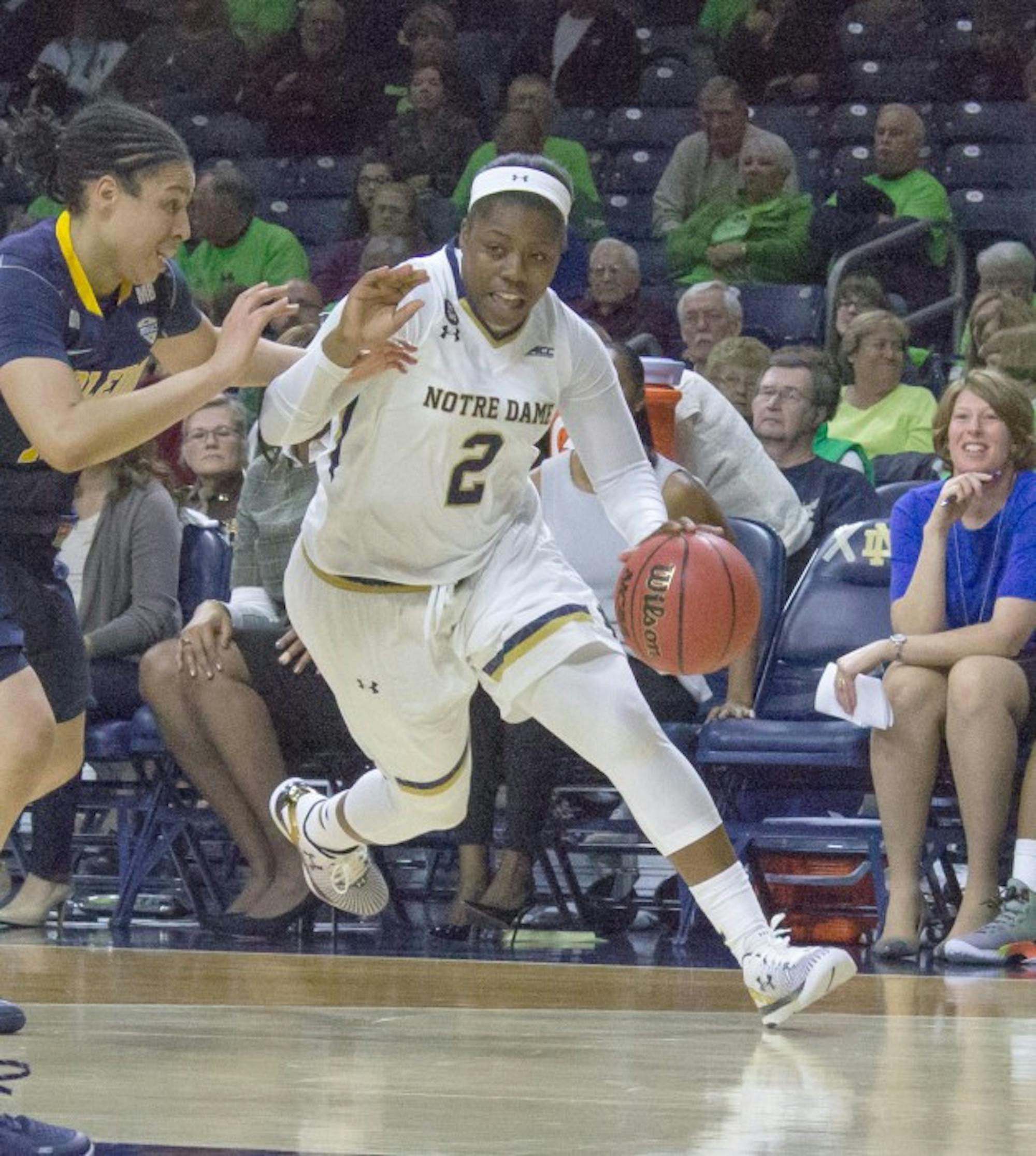 Freshman guard Arike Ogunbowale drives past a Toledo defender during Notre Dame’s 74-39 win on Nov. 18 at Purcell Pavilion.