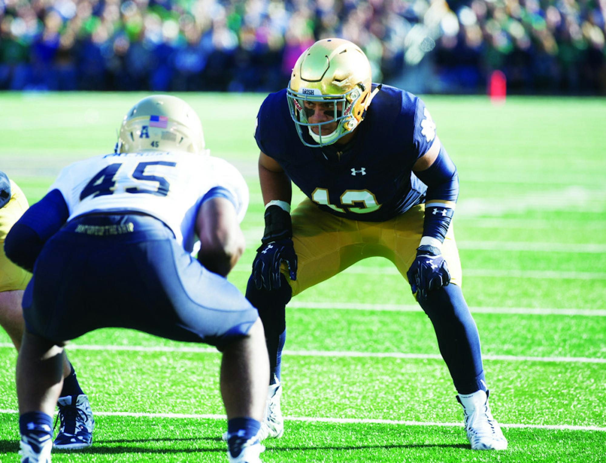 Irish sophomore tight end Tyler Luatua lines up across from Navy sophomore linebacker Micah Thomas during Notre Dame’s 41-24 victory over the Midshipmen on Oct. 10 at Notre Dame Stadium.