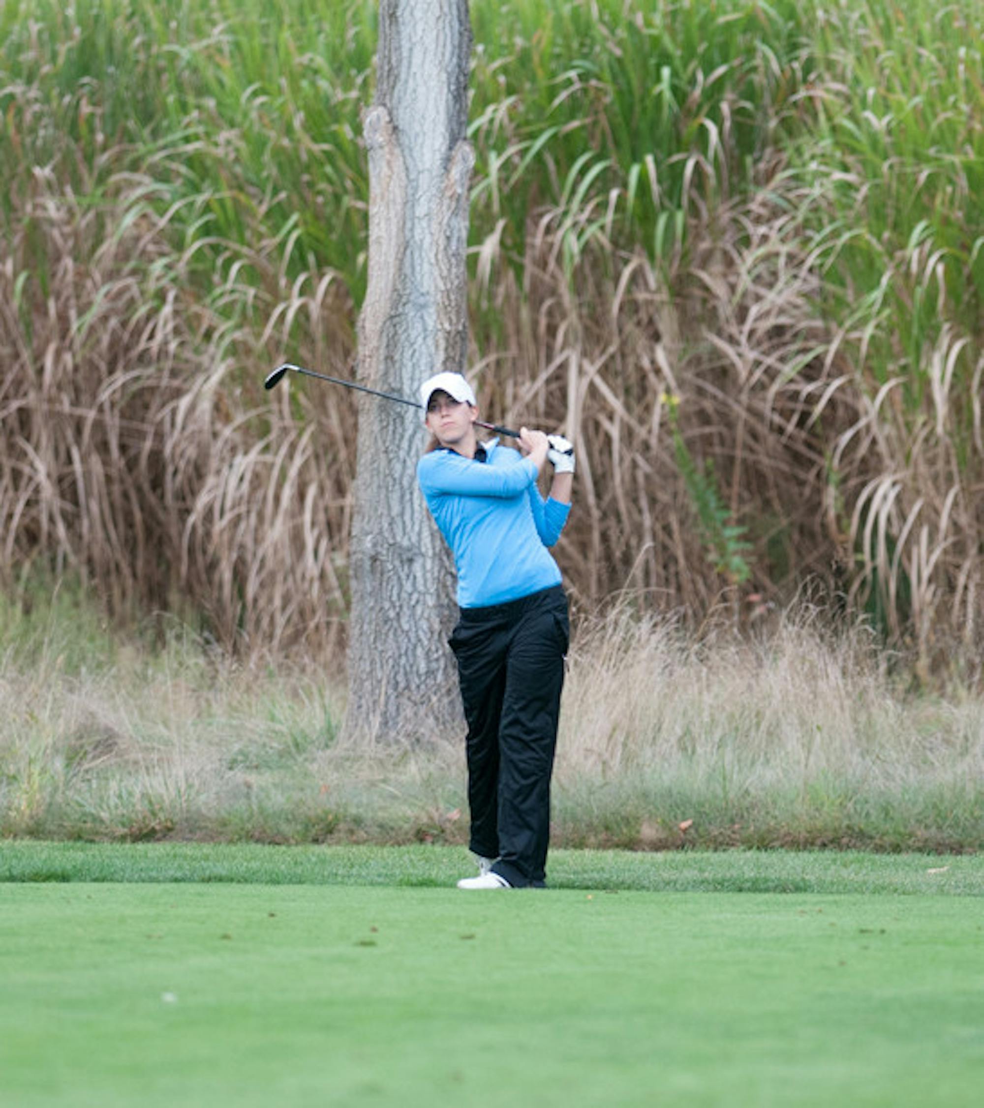 Belles senior Janice Heffernan hits a shot at the O’Brien National Invitational on Sept. 15, 2013, at Warren Golf Course.