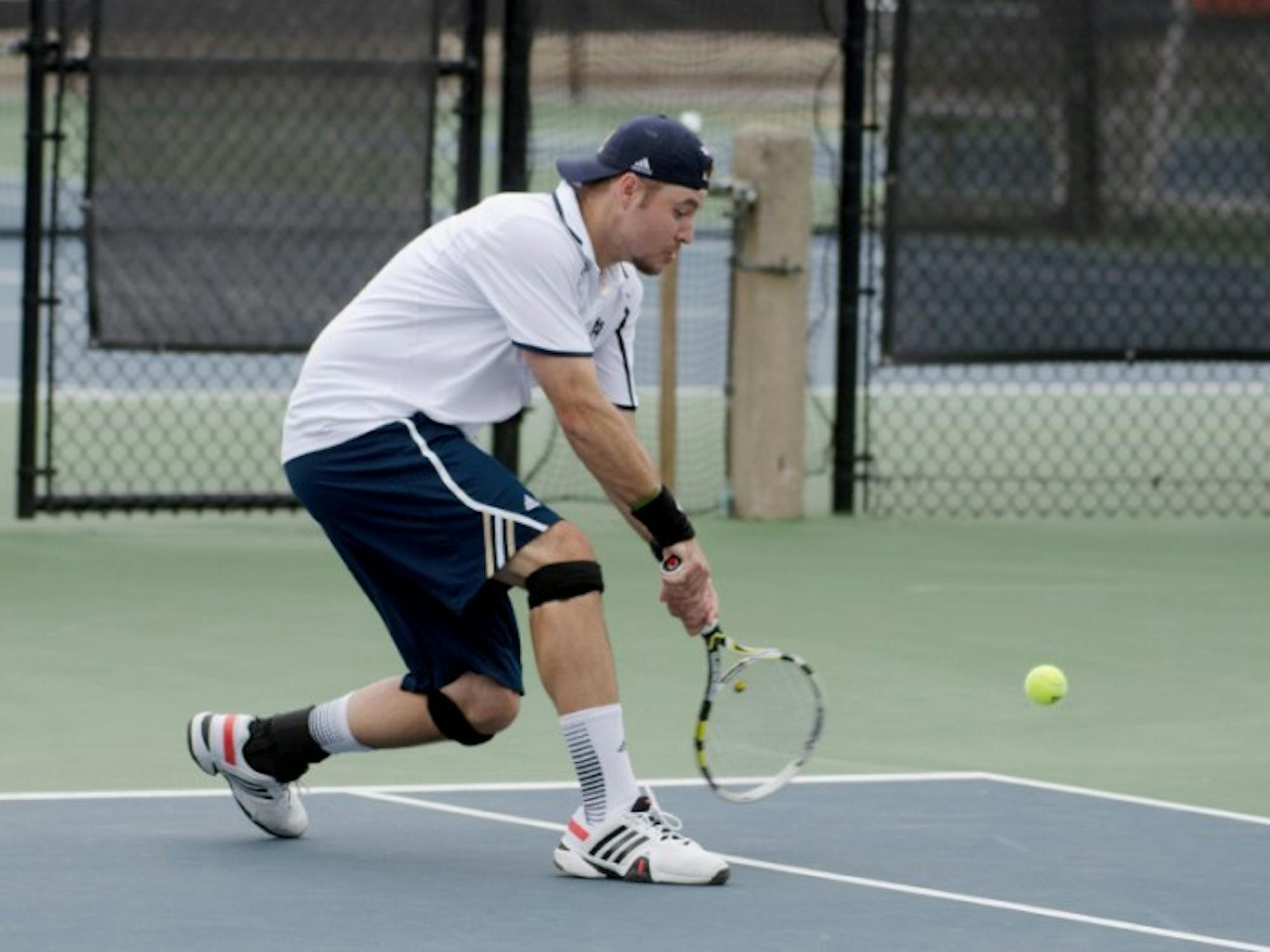 Senior Billy Pecor returns a hit during Notre Dame’s match against Florida State on April 13 at Eck Tennis Pavilion. The Irish beat the Seminoles, 6-1, and Pecor won his doubles match, 8-5.