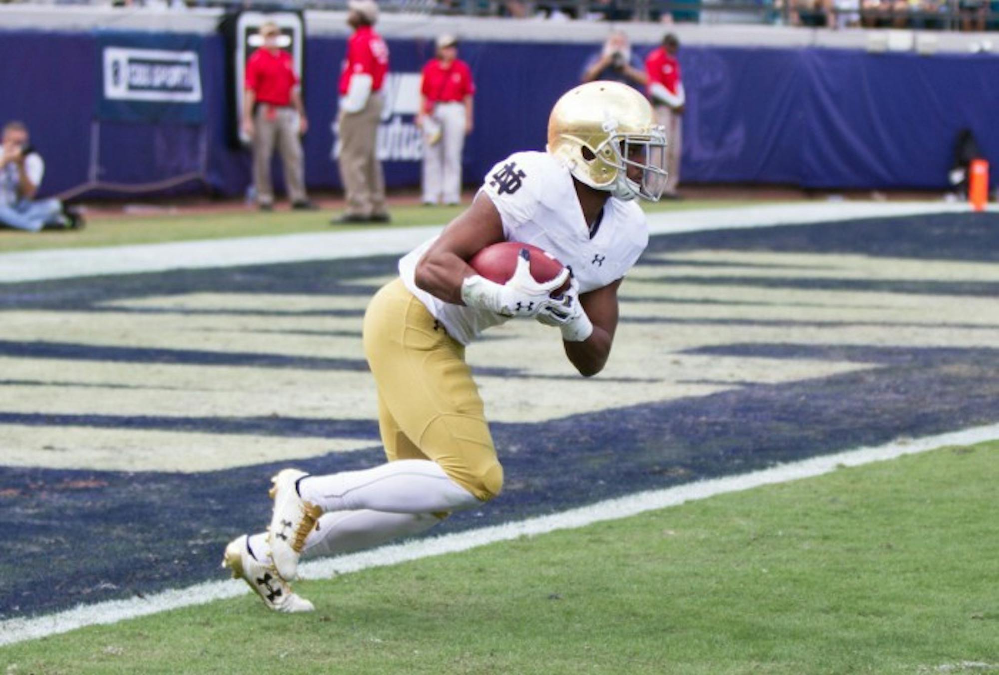 Irish sophomore receiver C.J. Sanders returns a kickoff during Notre Dame’s 28-27 loss to Navy on Nov. 5 at EverBank Field. Sanders returned the opening kickoff against Army on Nov. 12 for a touchdown.