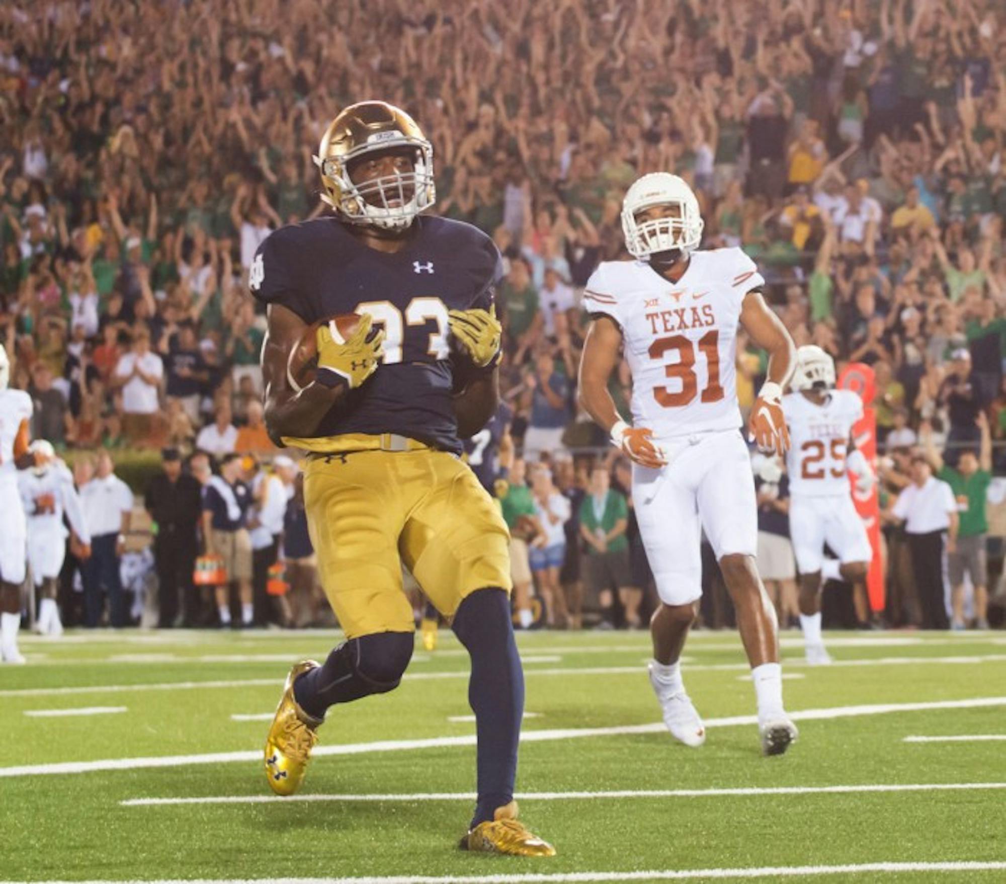 Irish sophomore running back Josh Adams crosses the goal line for a touchdown during Notre Dame’s 38-3 win last season over Texas on Sept. 5. Adams rushed for two touchdowns in the game — his collegiate debut — as the Irish routed the Longhorns. Adams enters his sophomore year alongside senior Tarean Folston as a starter on the depth chart.