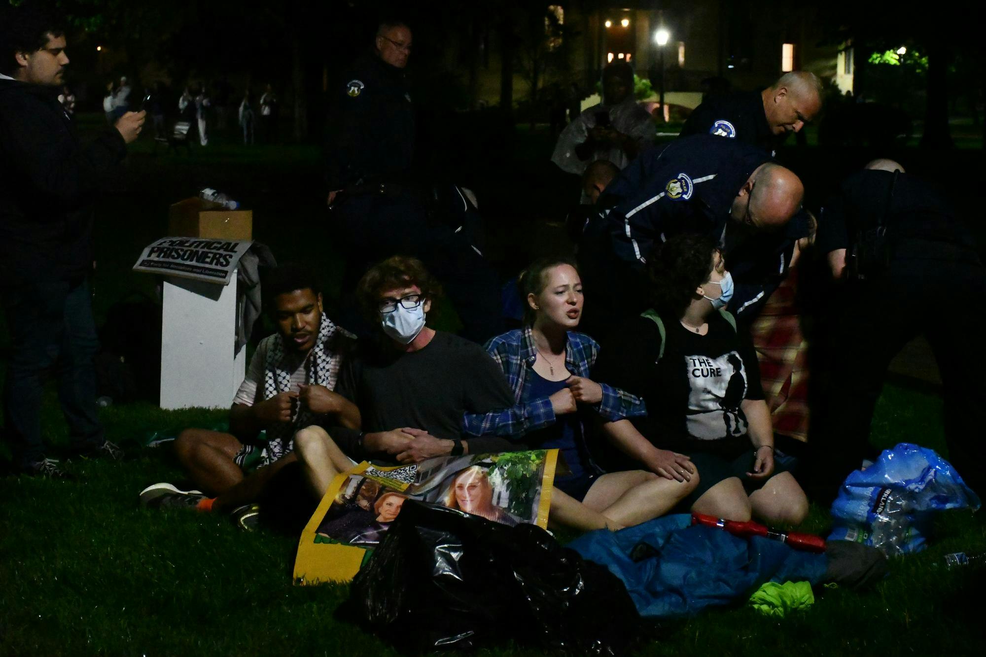 After being told to disperse, students linked arms on the God Quad. NDPD subsequently arrested everyone in the circle, as well as two others.