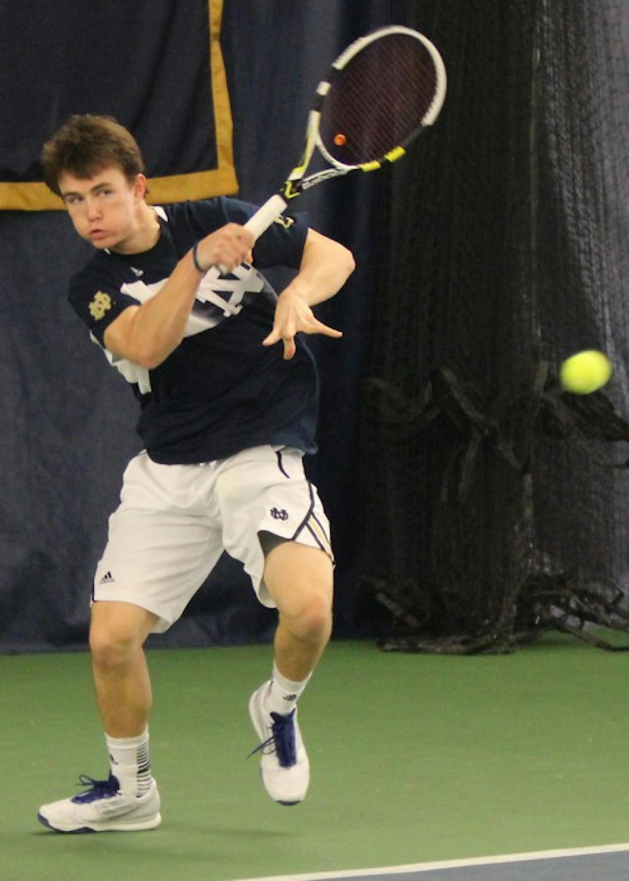 Irish senior Greg Andrews hits a shot during Notre Dame's 4-2 loss to Ohio State on Saturday in the Eck Tennis Center.