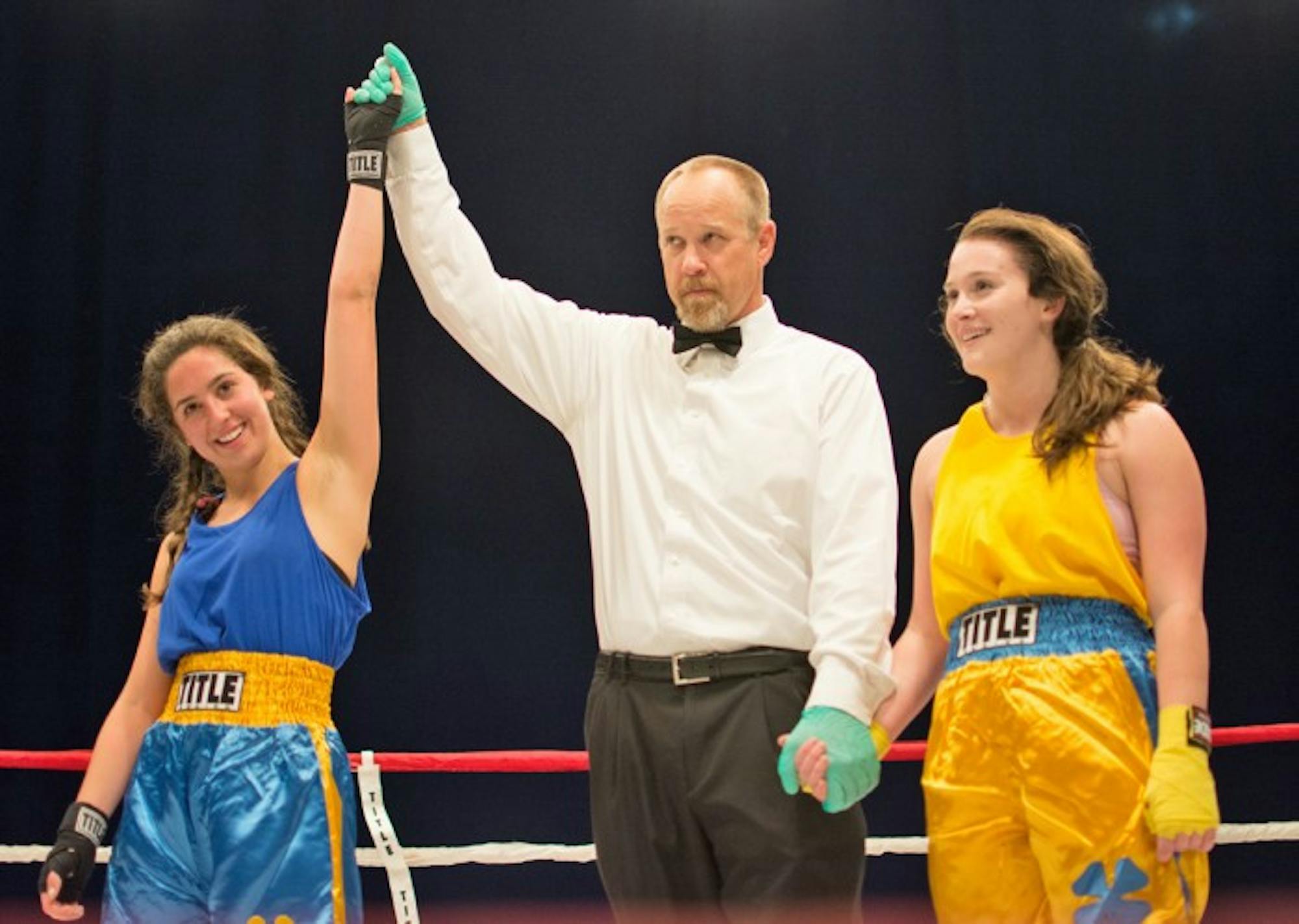 Senior Ava Stachelski, left, is declared the winner by unanimous decision after her semifinal bout with junior Caitlyn Beauchamp on Tuesday night at Joyce Center Fieldhouse.