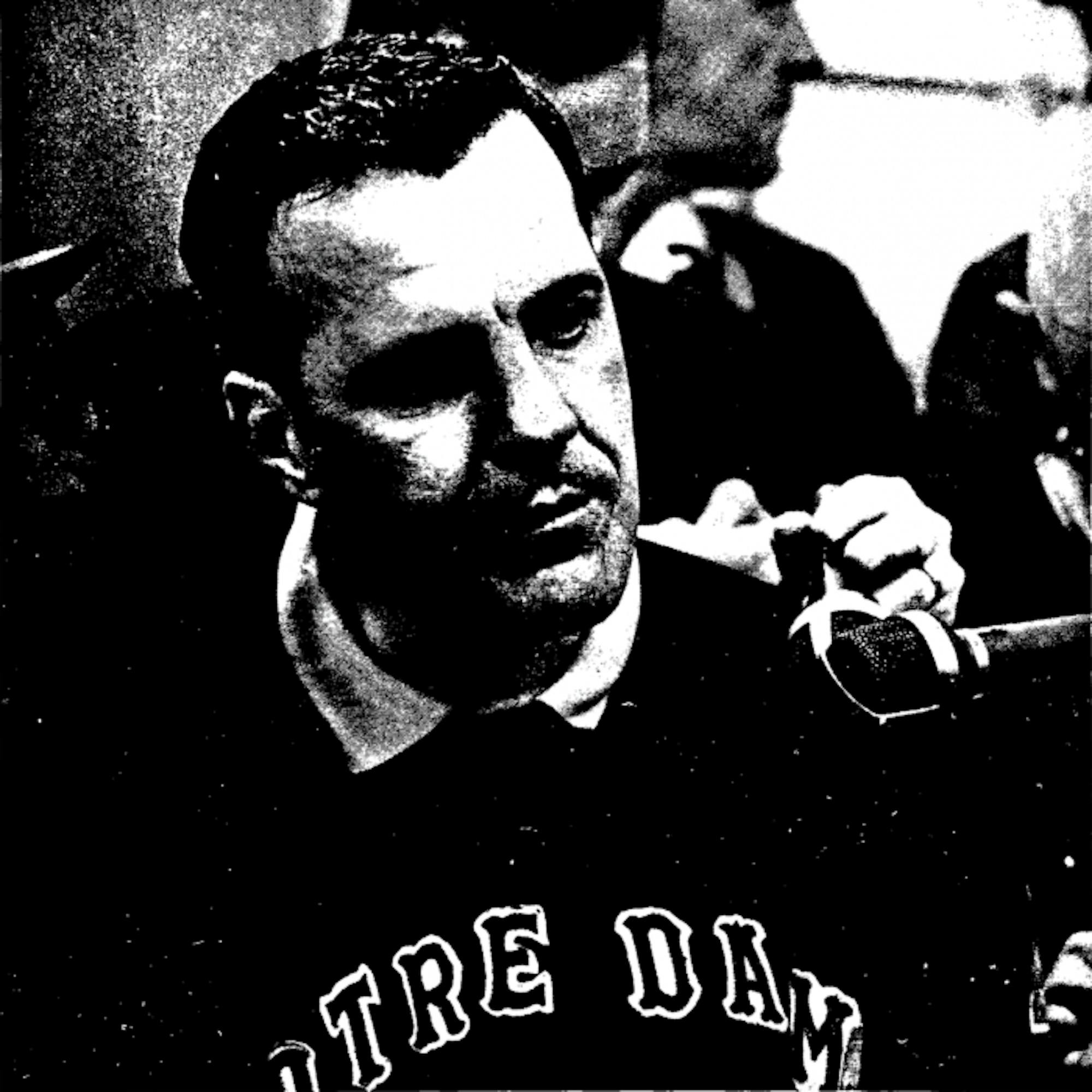Former Irish head coach Ara Parseghian collects his thoughts before addressing the press following Notre Dame’s 51-0 win over USC on Nov. 26, 1966. The Irish won their first of two championships under Parseghian that year.