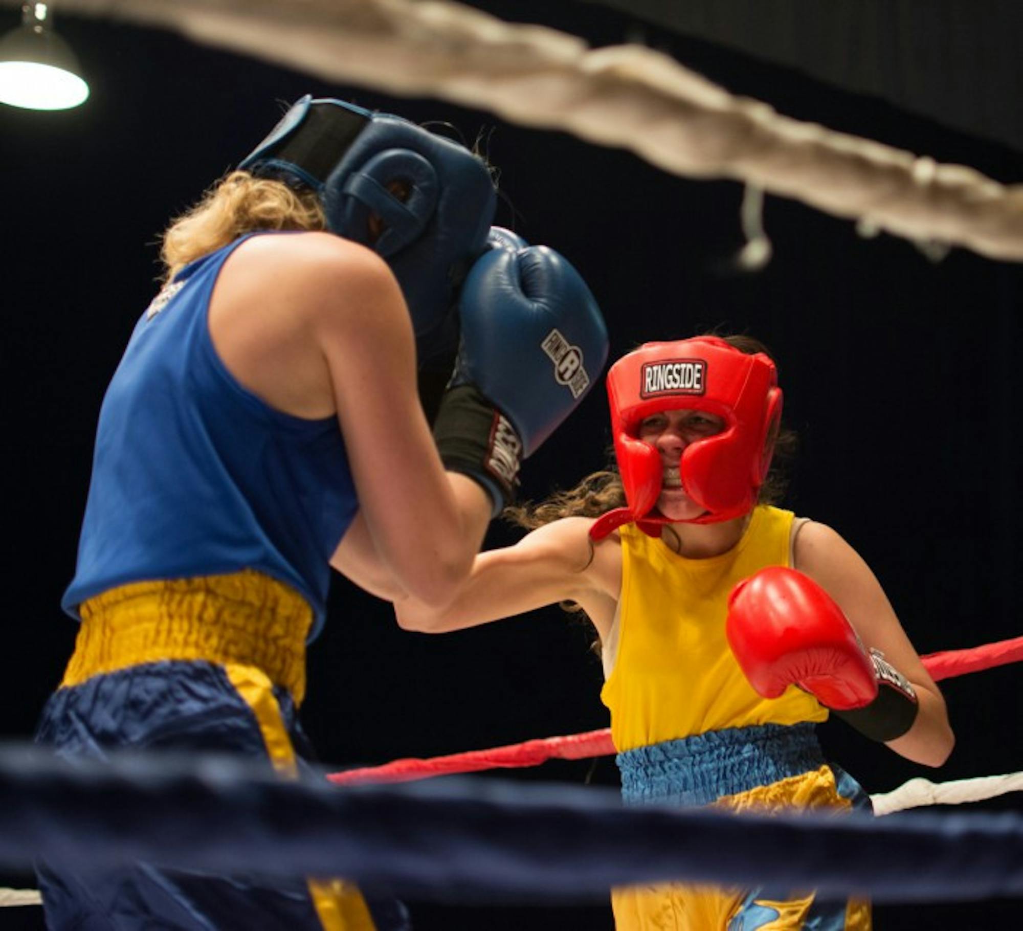 Senior Val “Valiswag” Williams unleashes a hook during her unanimous decision victory over sophomore Mercedes “Merciless” De la Rosa in the semifinal round Tuesday night in Joyce Center Fieldhouse.