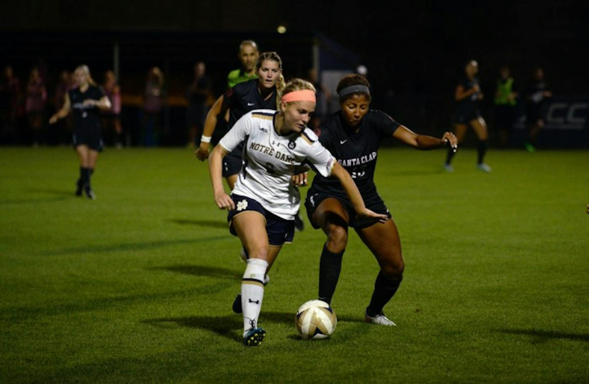 Irish freshman forward Natalie Jacobs dribbles past a defender during Notre Dame’s 2-1 win over Santa Clara on Aug. 28.