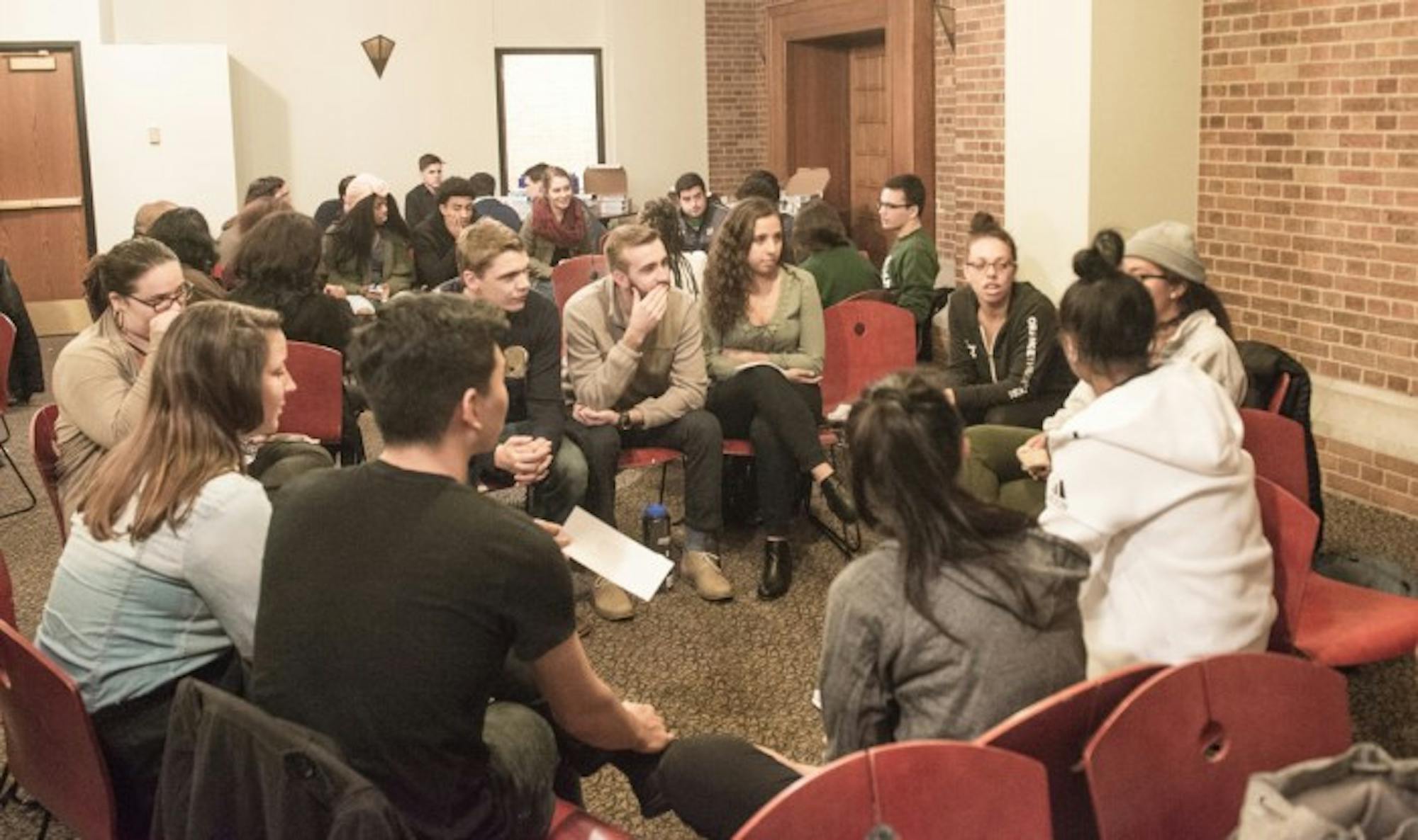 Students participate in group discussions during Tuesday night's forum in the Hospitality Room of South Dining Hall. The forum discussed ways to build a more inclusive Notre Dame community.