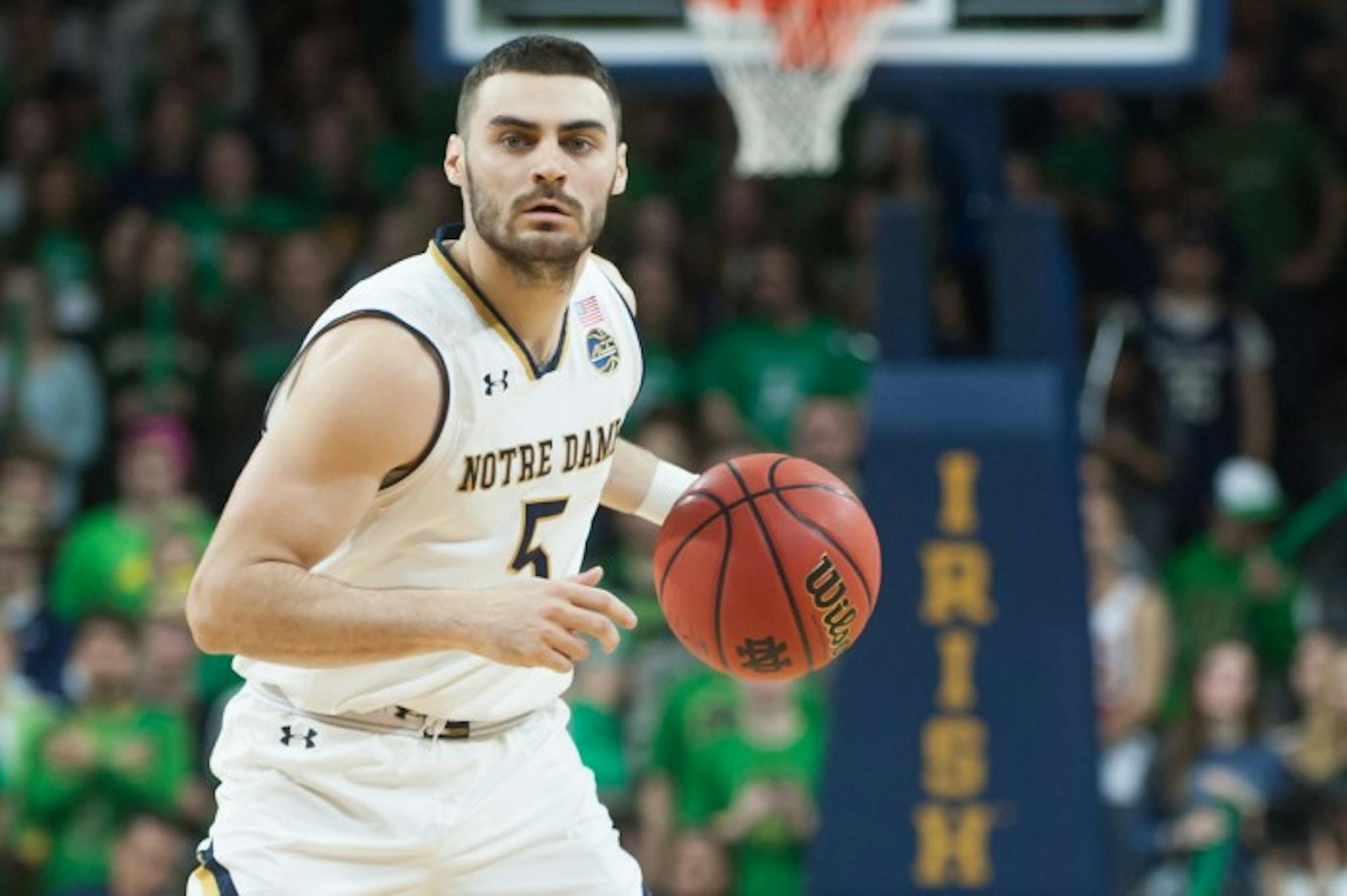 Junior Irish guard Matt Farrell dribbles up the court in Notre Dame's 84-66 victory over Syracuse on Saturday at Purcell Pavilion. Farrell had 15 points and nine assists in the game.