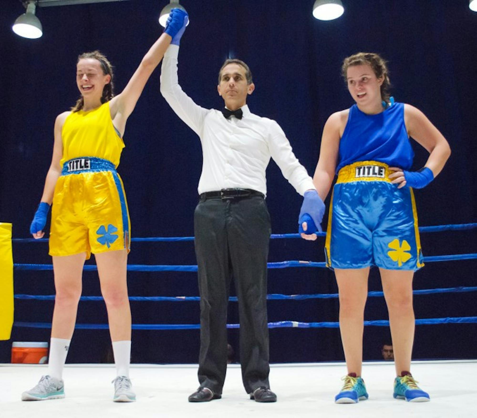 A referee raises class of 2016 alumna Maggie Adams’ arm in victory after her bout with senior Isabella Bianco at the 2015 Baraka Bouts.