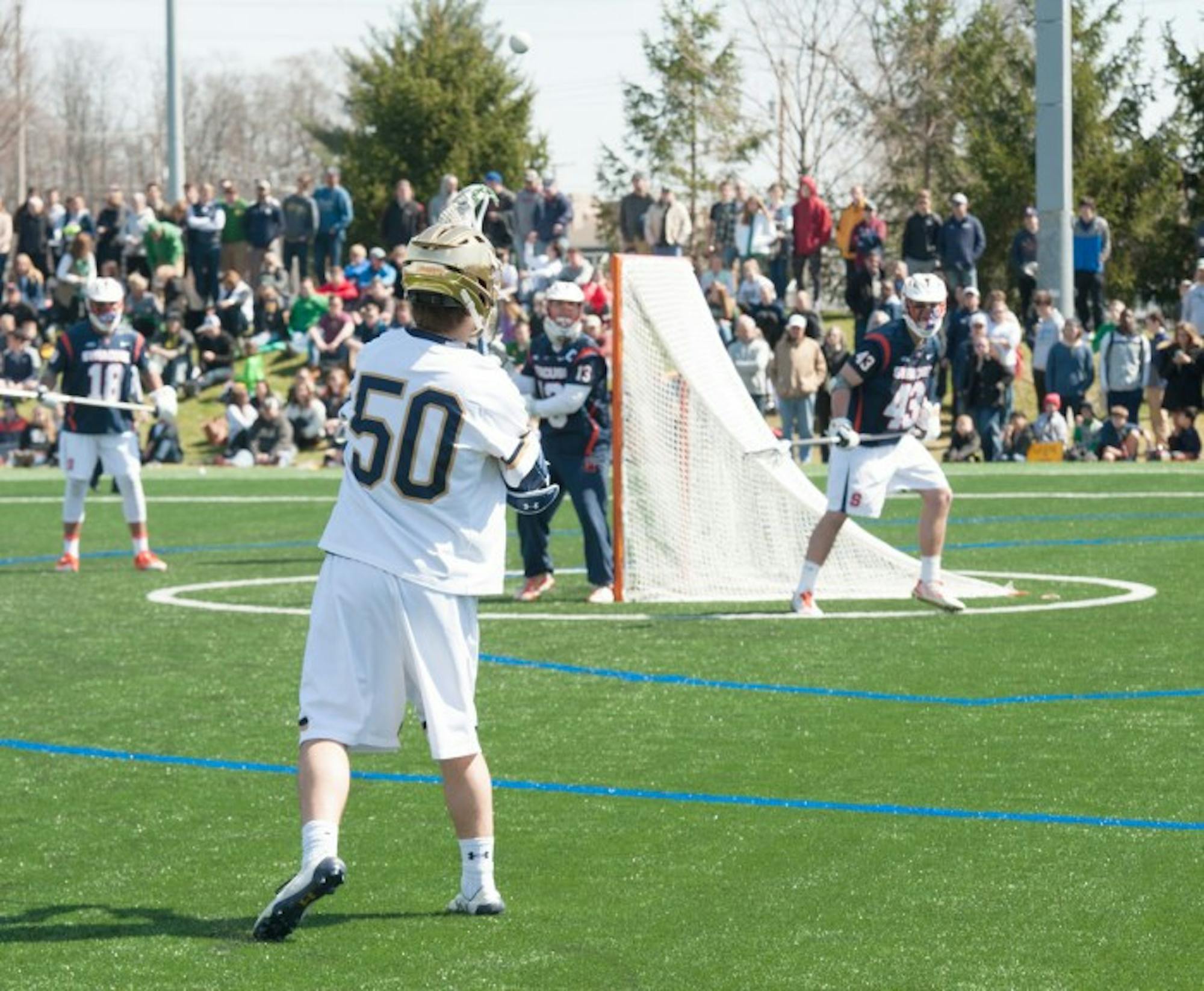 Irish sophomore attack Ryder Garnsey passes the ball during Notre Dame’s 11-10 loss to Syracuse on April 1 at Arlotta Stadium.