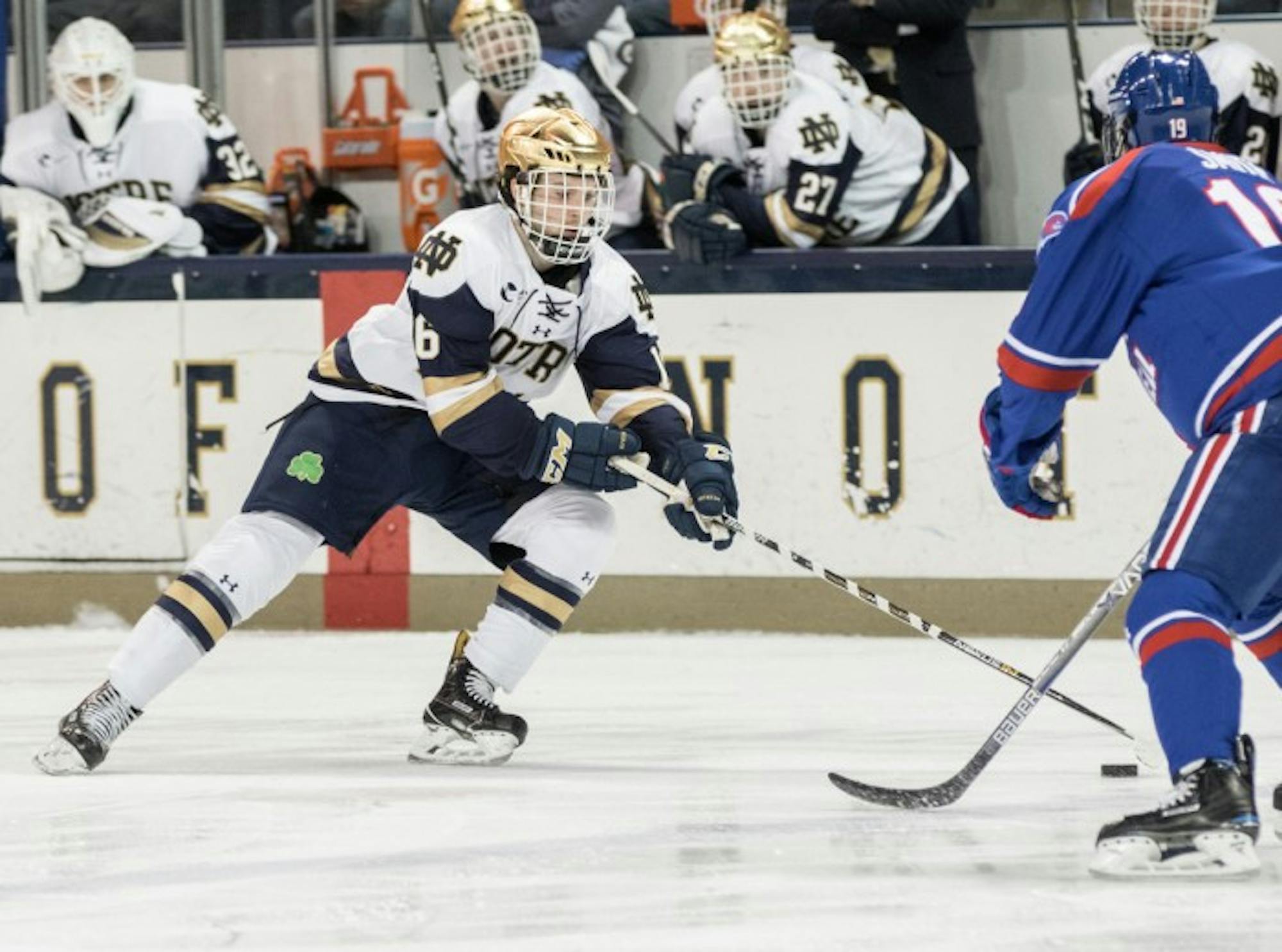 Irish junior forward Connor Hurley hustles up the ice during Notre Dame’s 4-1 loss to UMass-Lowell on Nov. 17.